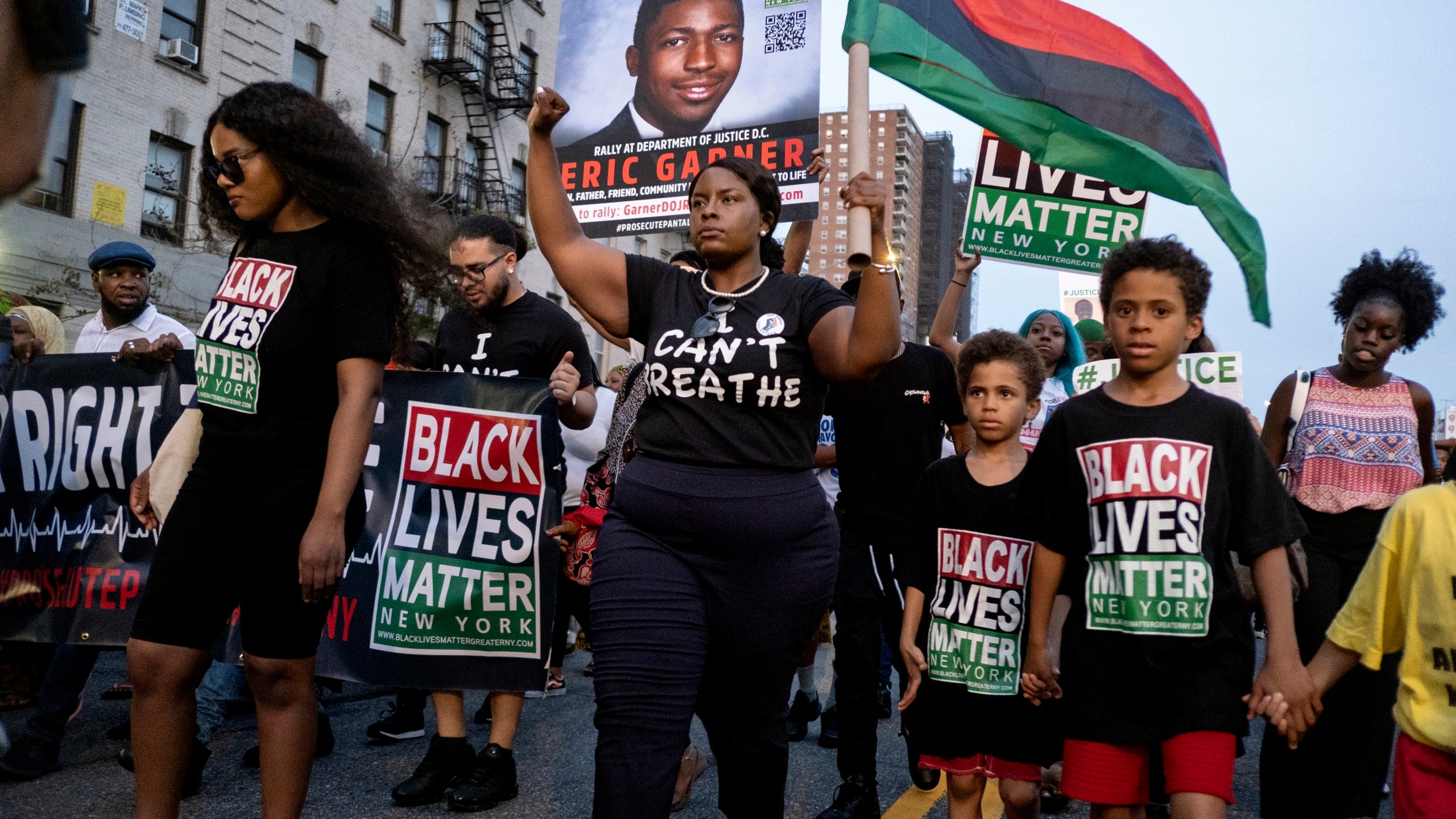 FILE - Activists with Black Lives Matter protest in the Harlem neighborhood of New York, Tuesday, July 16, 2019, in the wake of a decision by federal prosecutors who declined to bring civil rights charges against New York City police Officer Daniel Pantaleo, in the 2014 chokehold death of Eric Garner. Wednesday, July 17, 2024 marks 10 years since the chokehold death of Eric Garner at the hands of New York City police officers who were trying to arrest him for selling loose cigarettes. (AP Photo/Craig Ruttle, File)