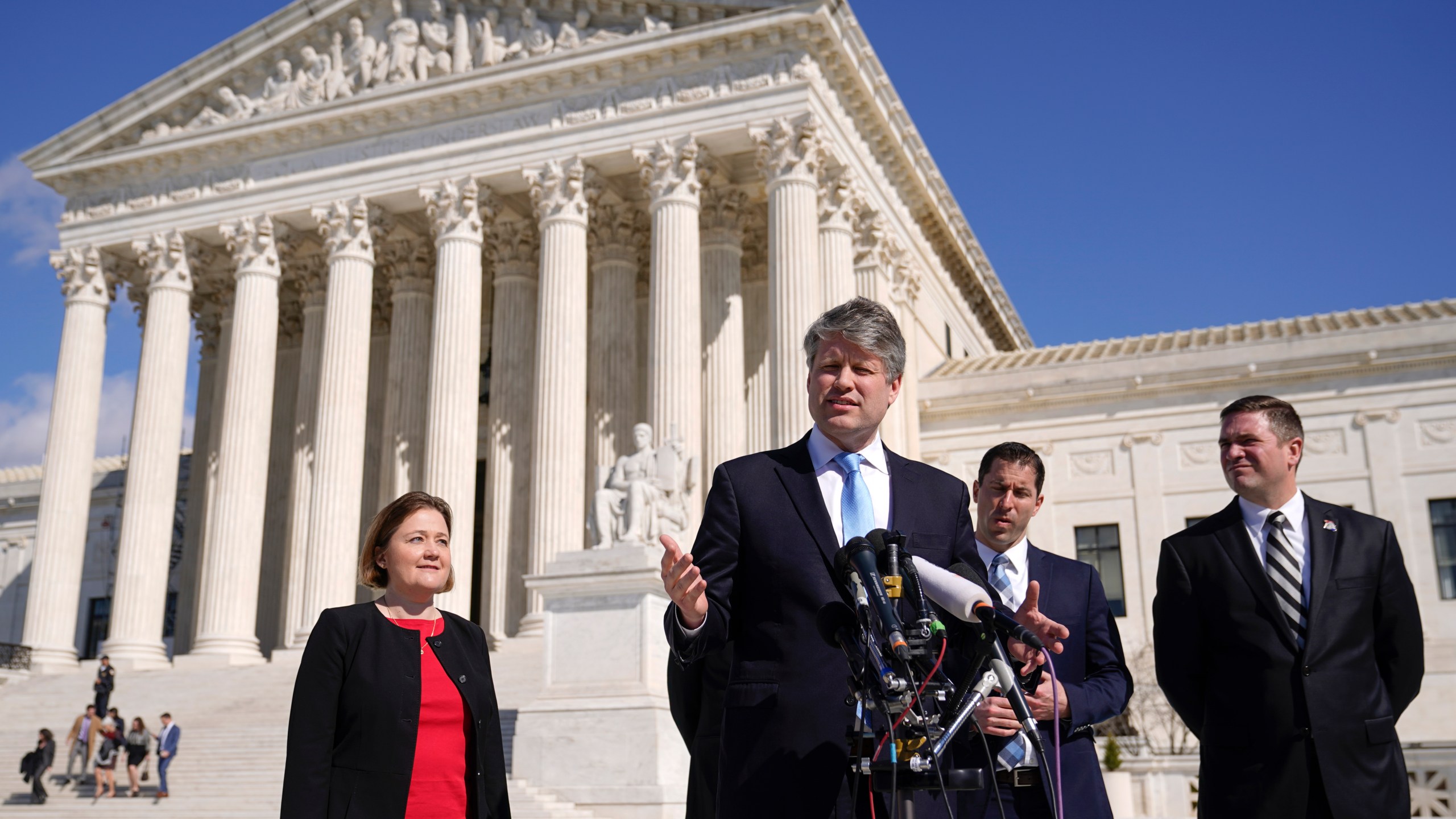 FILE - Nebraska Attorney General Mike Hilgers speaks with reporters outside the Supreme Court on Capitol Hill in Washington, Feb. 28, 2023. Thousands of Nebraskans with felony convictions could be denied voting rights under an opinion from Hilgers released Wednesday, July 17, 2024. (AP Photo/Patrick Semansky, File)