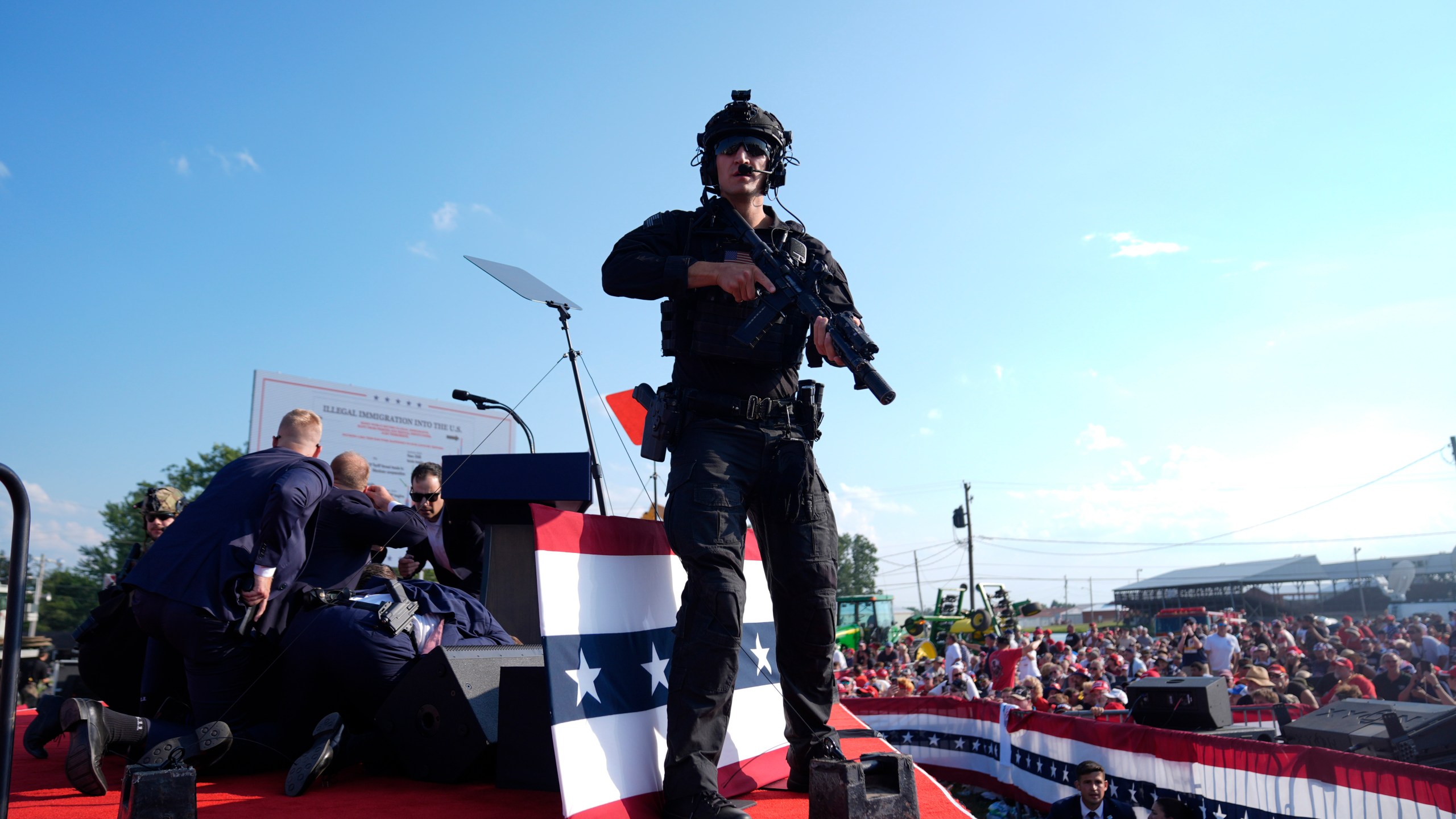 Republican presidential candidate former President Donald Trump is surrounded by U.S. Secret Service agents on stage at a campaign rally, Saturday, July 13, 2024, in Butler, Pa. (AP Photo/Evan Vucci)