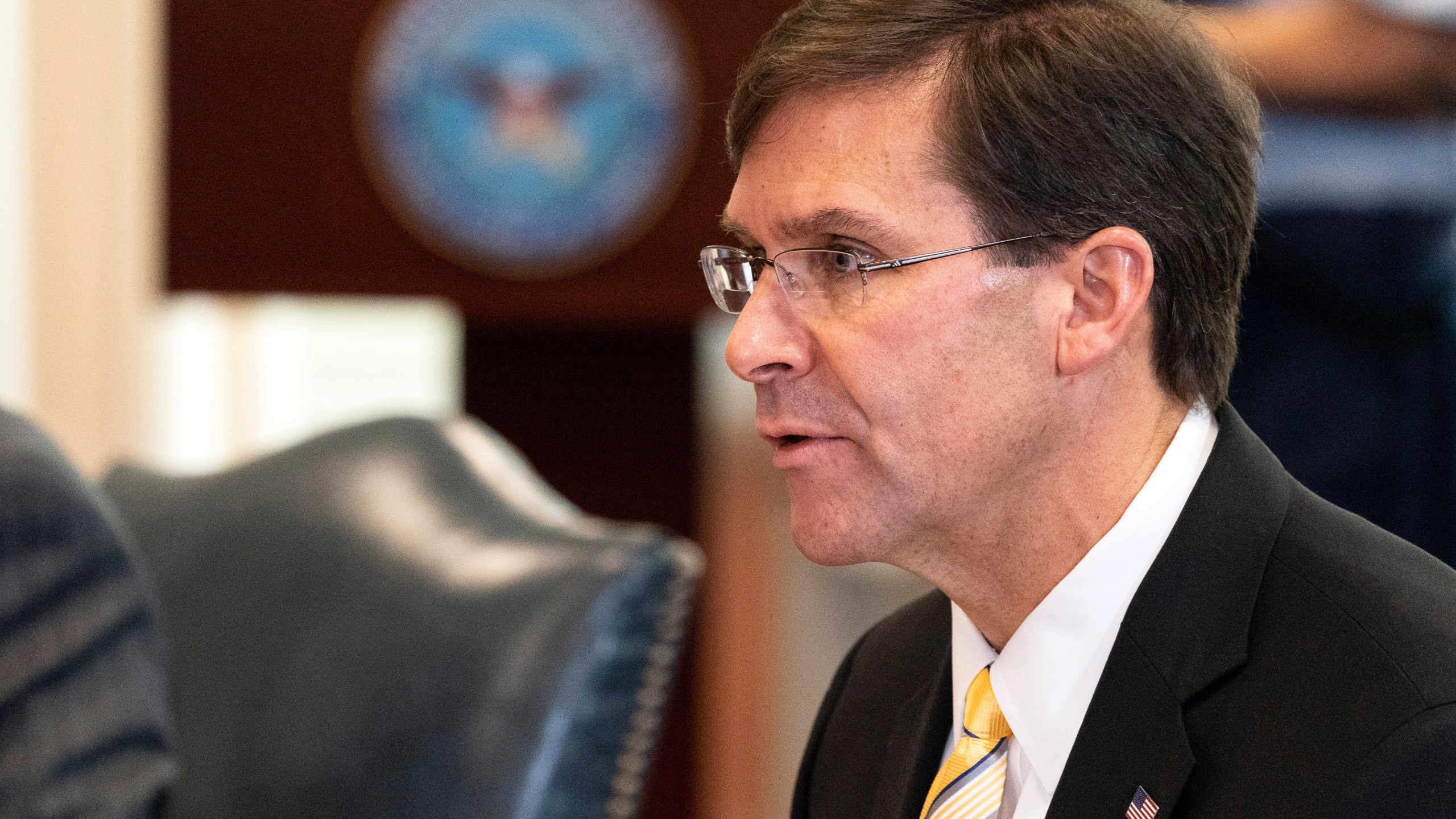 FILE - Secretary of Defense Mark Esper speaks before a meeting with Romanian Defense Minister Nicolae Ciuca, Oct. 8, 2020, at the Pentagon, in Washington. Esper said Wednesday, July 17, 2024, that it was time for the Biden administration "to do better than just playing defense" to Iranian threats on Trump administration officials.(AP Photo/Alex Brandon, File)