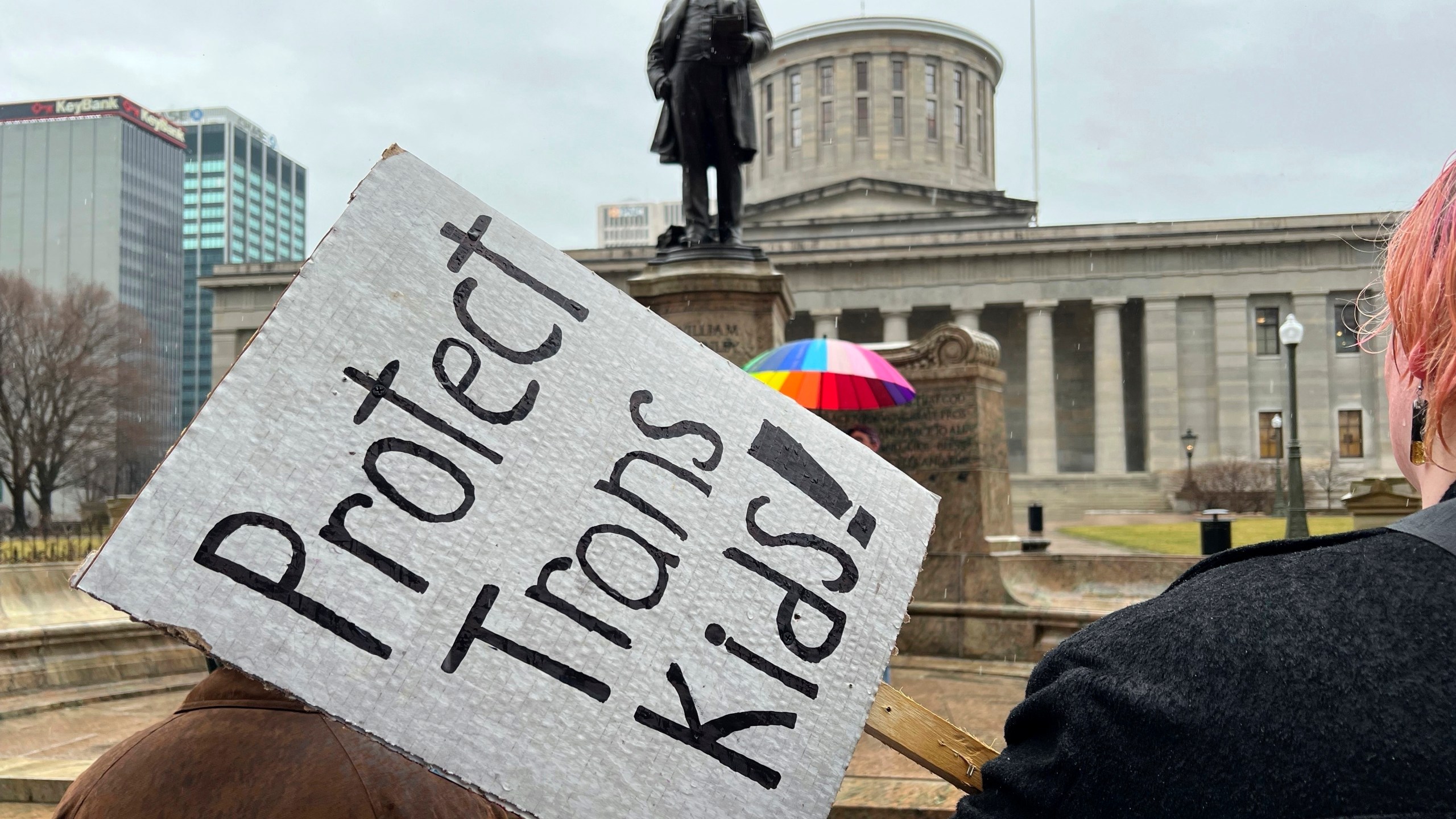 FILE - Demonstrators advocating for transgender rights and healthcare stand outside of the Ohio Statehouse, Jan. 24, 2024, in Columbus, Ohio. A federal appeals court on Wednesday, July 17, refused to lift a judge's order temporarily blocking the Biden administration’s new Title IX rule meant to expand protections for LGBTQ+ students. (AP Photo/Patrick Orsagos, File)