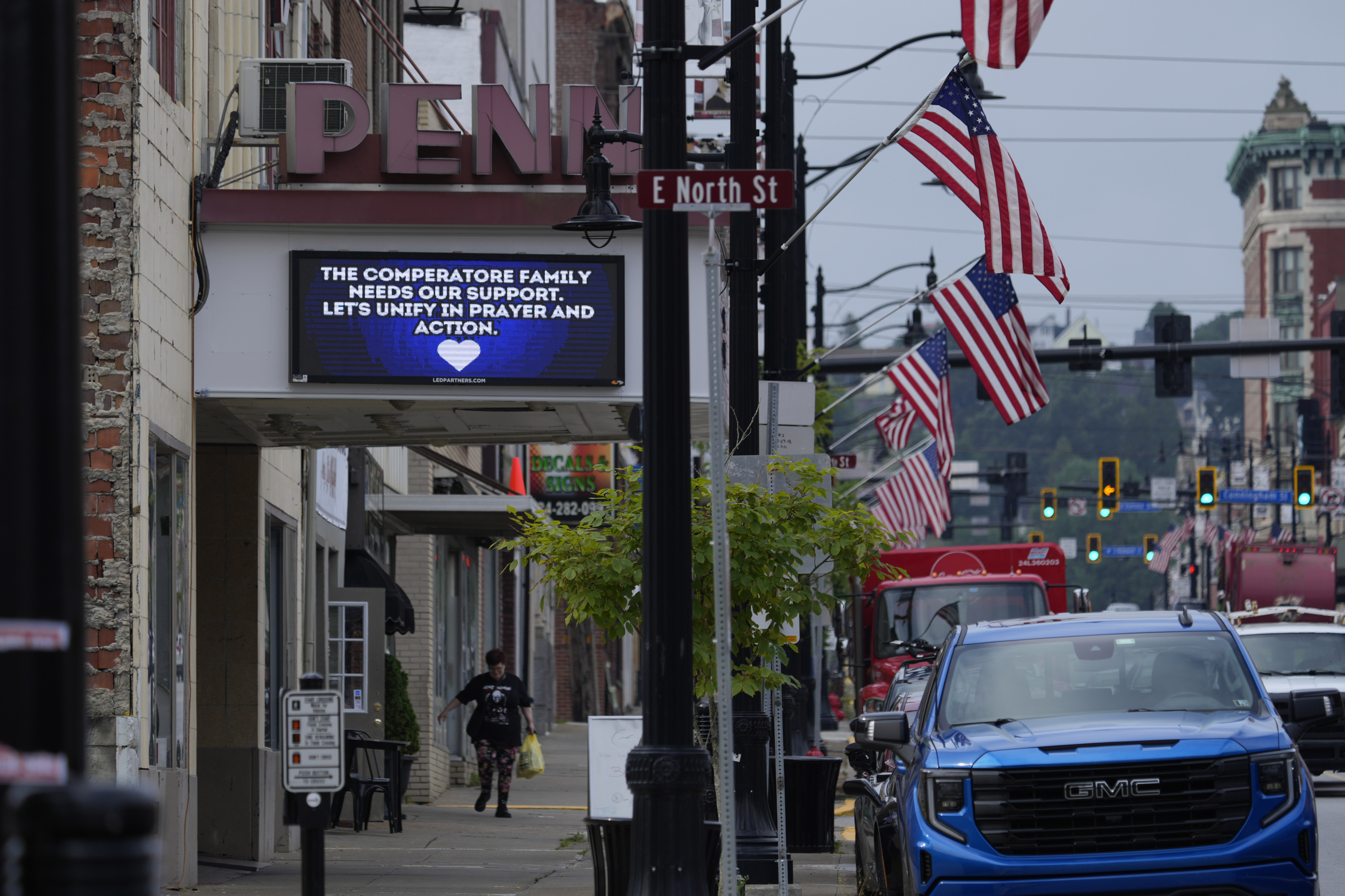 A memorial for Corey Comperatore is seen on a billboard at the Penn Theater in Butler, Pa., Thursday, July 18, 2024. Comperatore was killed at rally for former President Donald Trump Saturday. (AP Photo/Eric Gay)