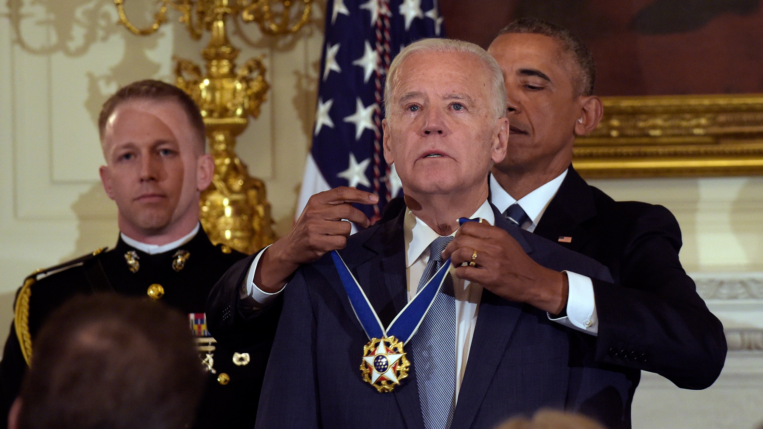 President Barack Obama presents Vice President Joe Biden with the Presidential Medal of Freedom during a ceremony in the State Dining Room of the White House in Washington, Jan. 12, 2017. (AP Photo/Susan Walsh)