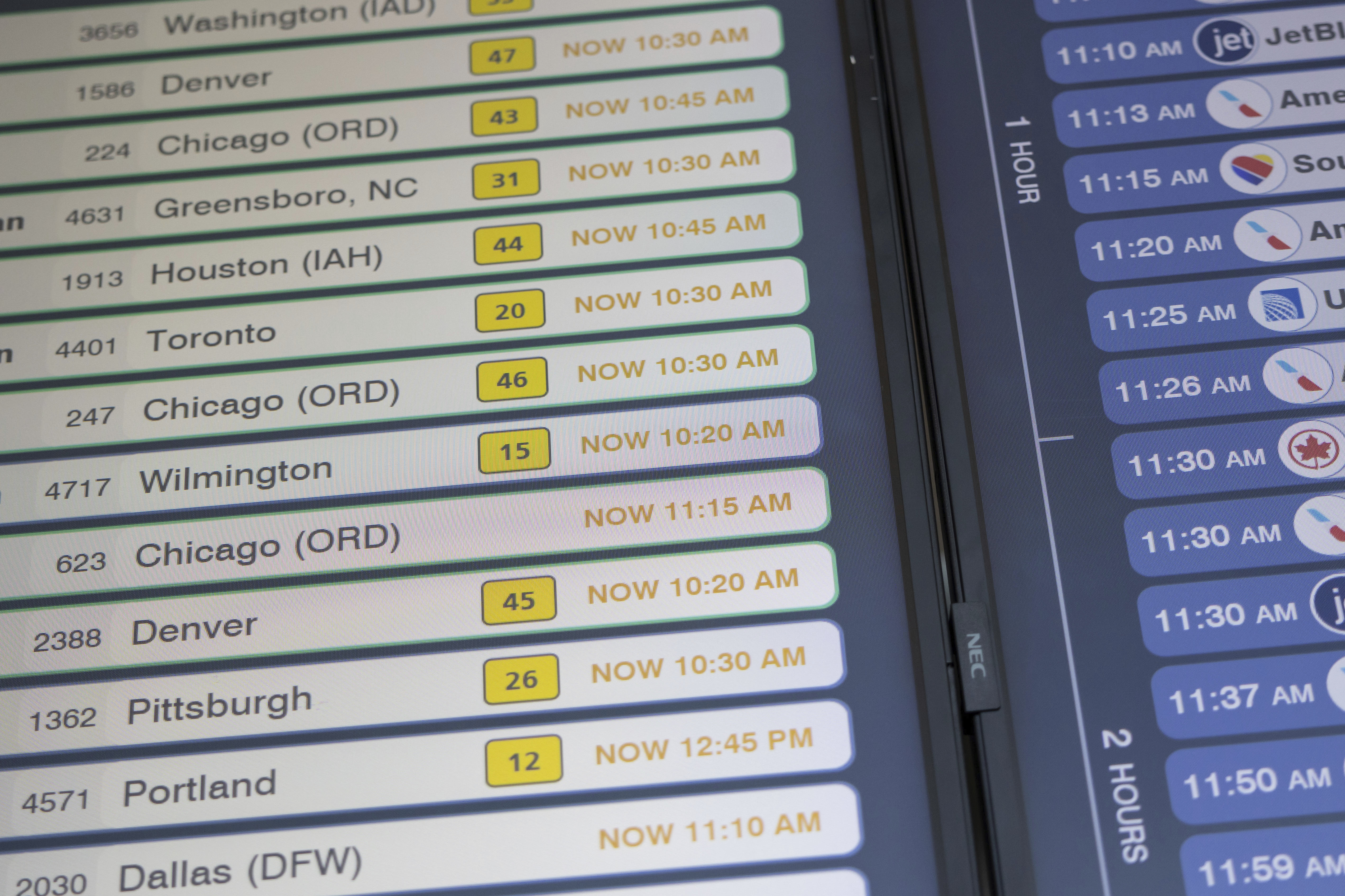 Delayed flight schedules are displayed on a screen at LaGuardia Airport in New York on Friday, July 19, 2024, after a faulty CrowdStrike update caused a major internet outage for computers running Microsoft Windows. (AP Photo/Yuki Iwamura)