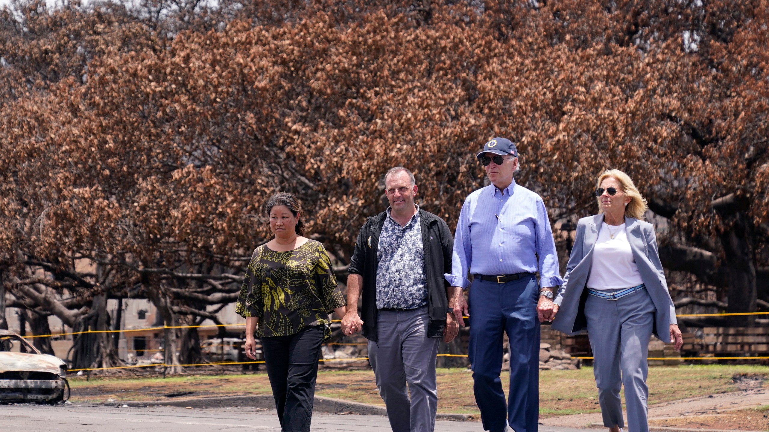 FILE - President Joe Biden, second right, and first lady Jill Biden, right, walk with Hawaii Gov. Josh Green, second from left, and his wife Jaime Green, Aug. 21, 2023, in Lahaina, Hawaii. David Letterman will headline a fundraiser with Biden in on July 29, 2024, at Green's home, a person familiar with the plans told The Associated Press. That's a sign that his campaign is forging ahead despite continued calls for the president to bow out of the 2024 race. (AP Photo/Evan Vucci, File)