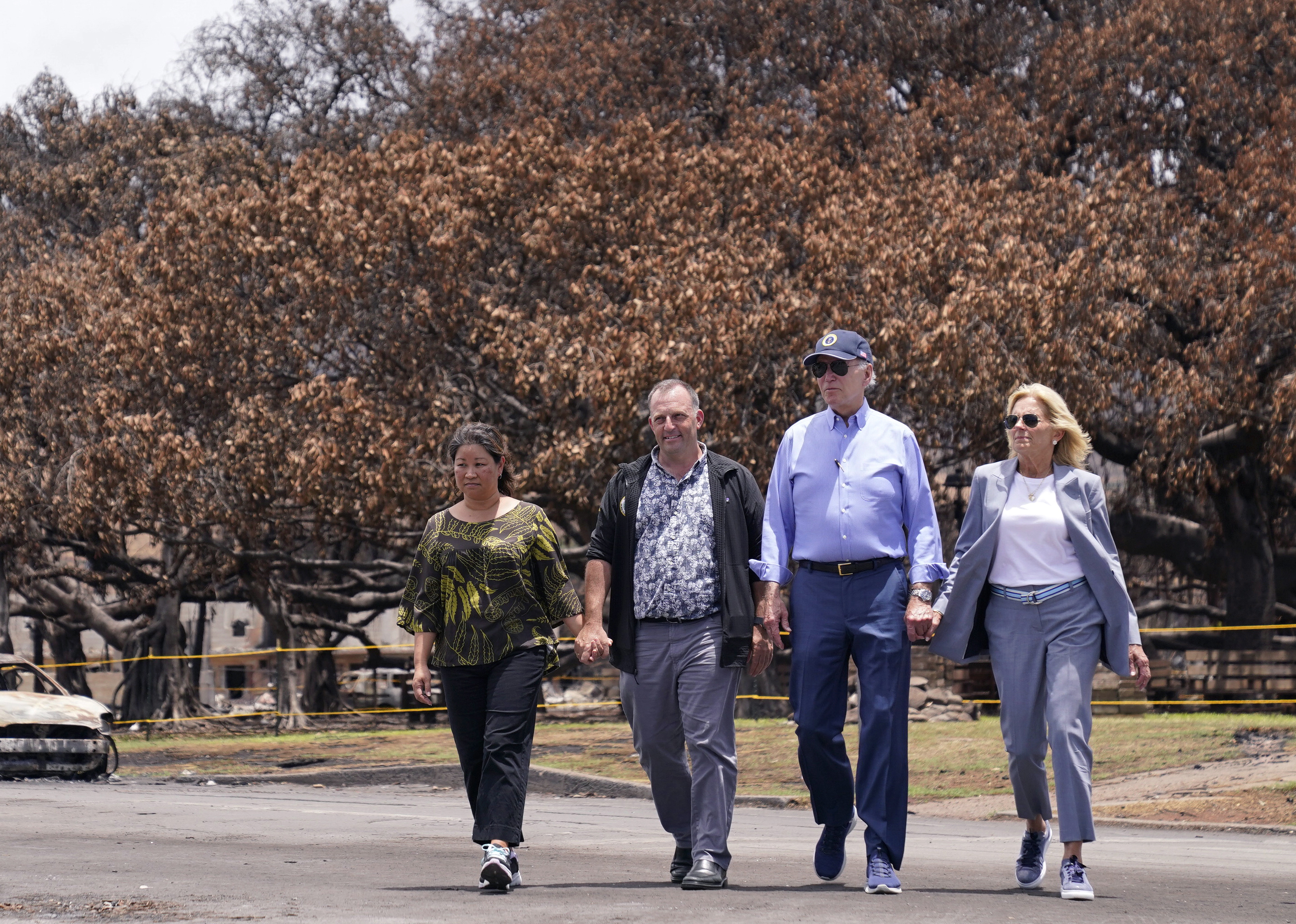 FILE - President Joe Biden, second right, and first lady Jill Biden, right, walk with Hawaii Gov. Josh Green, second from left, and his wife Jaime Green, Aug. 21, 2023, in Lahaina, Hawaii. David Letterman will headline a fundraiser with Biden in on July 29, 2024, at Green's home, a person familiar with the plans told The Associated Press. That's a sign that his campaign is forging ahead despite continued calls for the president to bow out of the 2024 race. (AP Photo/Evan Vucci, File)
