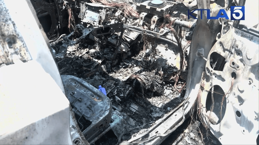 The charred remains of a vehicle that was set on fire by a suspect in the Hollywood Hills on July 13, 2024. (KTLA)