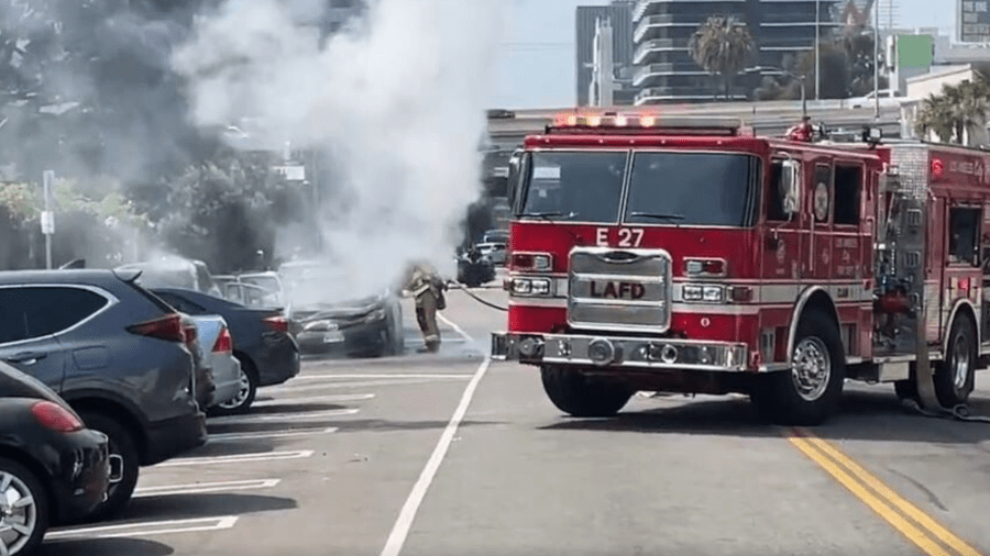 Firefighters extinguished two burning vehicles that were set ablaze by a woman in the Hollywood Hills on July 13, 2024. (Citizen)