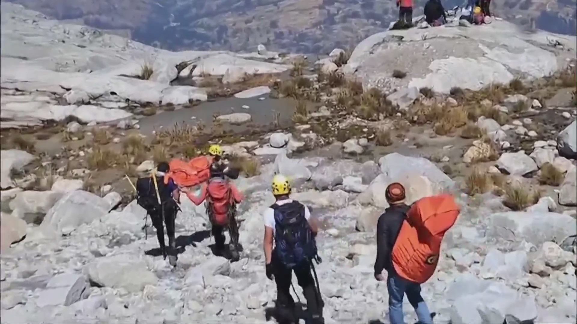 Team members carried Bill Stampfl's body down Mount Huascarán in Peru. (Ryan Cooper)