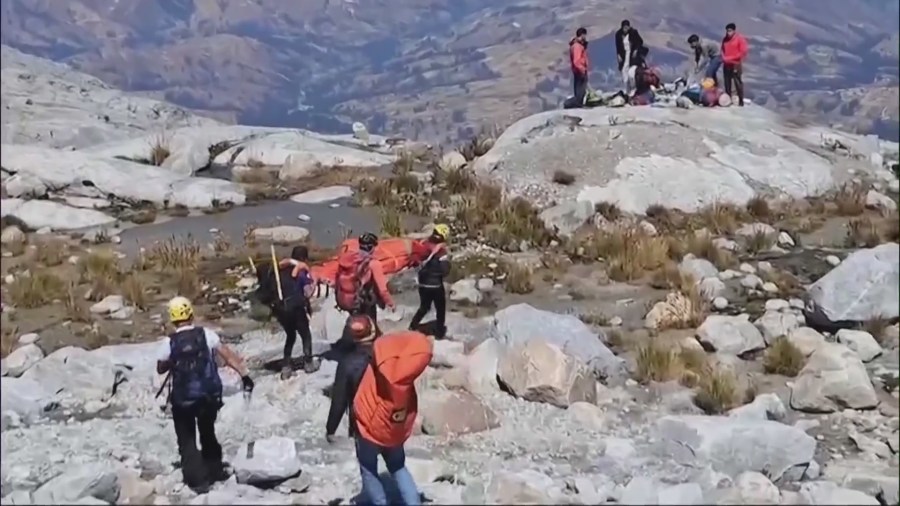 Team members carried Bill Stampfl's body down Mount Huascarán in Peru. (Ryan Cooper)