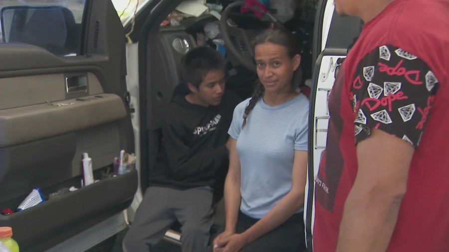 Alfredo Morales and his sister is seen in the truck they live in with their family at a Pacoima park. (KTLA)