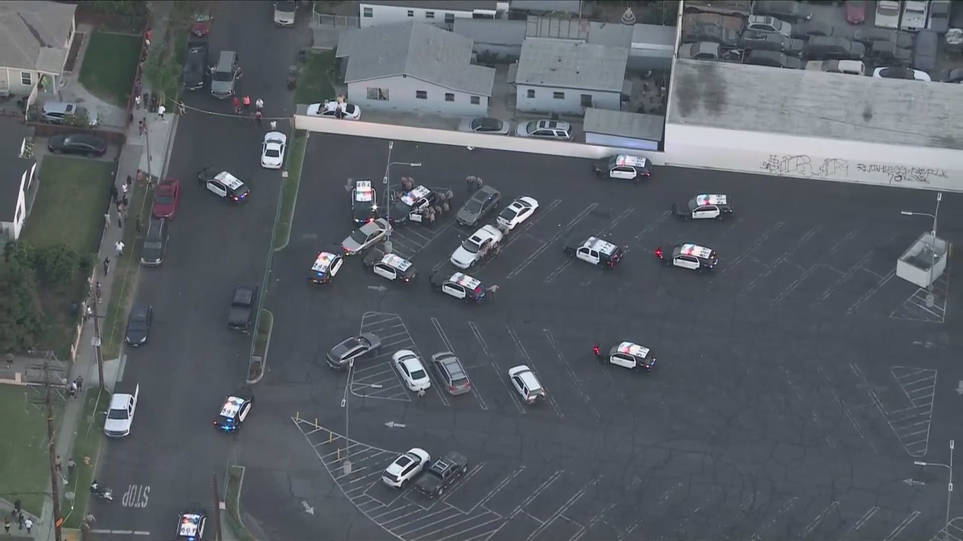 A large number of patrol cars surrounded the suspects during a stand off at a Compton parking lot on July 5, 2024. (KTLA)