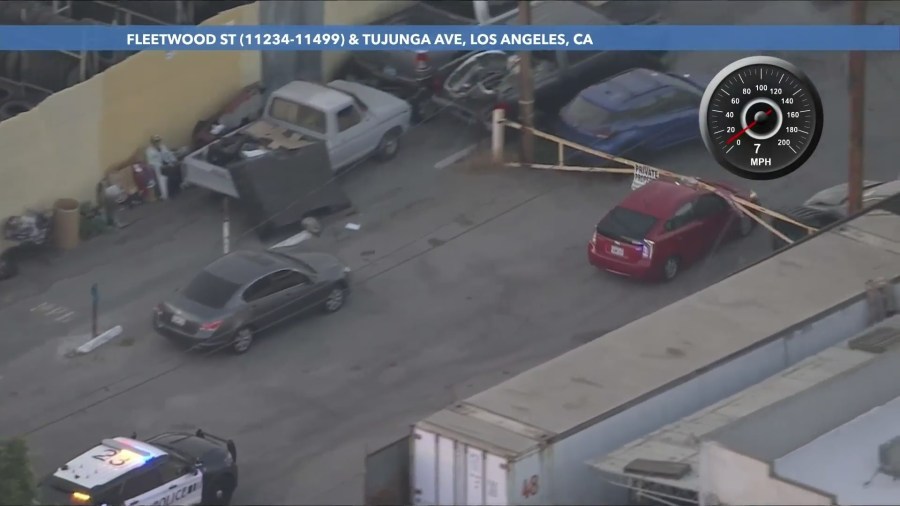 The suspect turned onto a dead-end street and rammed a metal gate. (KTLA)