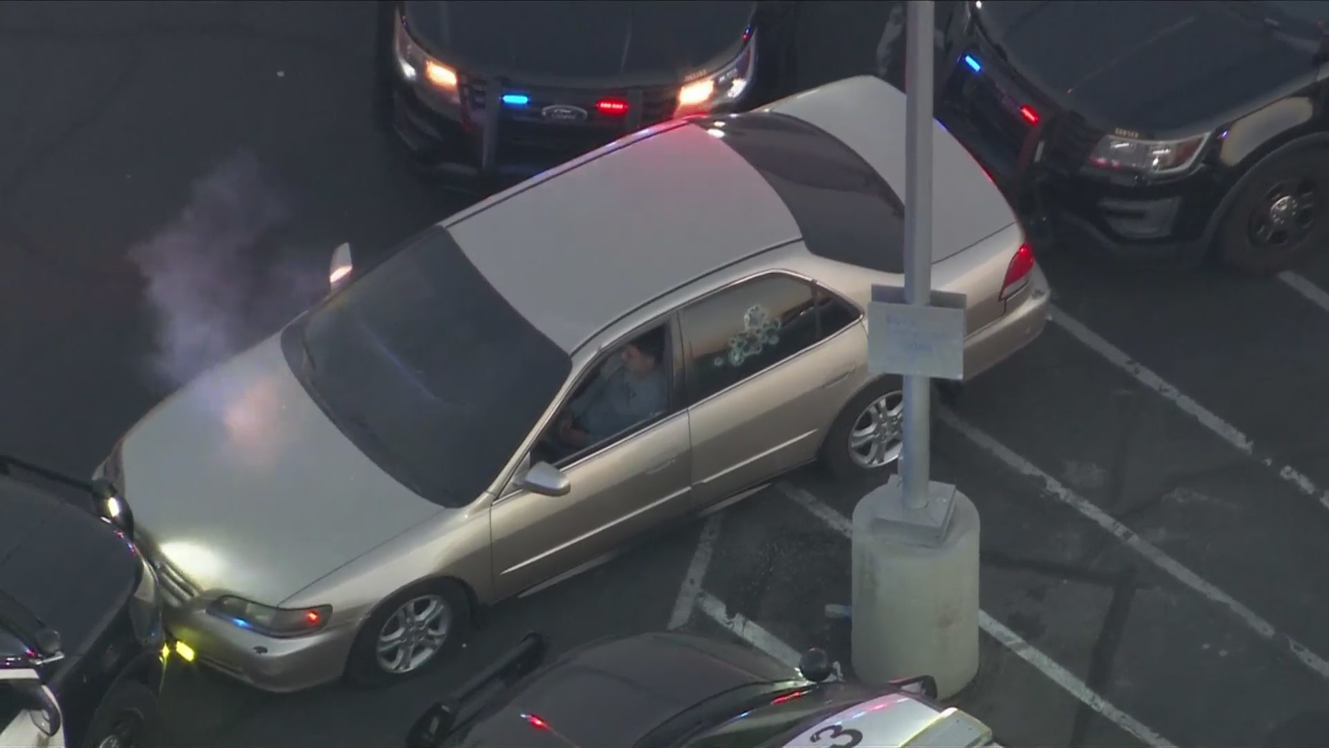 Pepper balls were deployed as the suspects remained inside their car at a Compton parking lot on July 5, 2024. (KTLA)