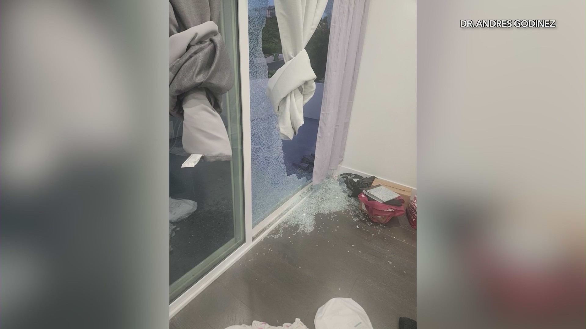 A glass patio door was shattered as a group of burglars ransacked a home in Woodland Hills in July 2024. (Andres Godinez)