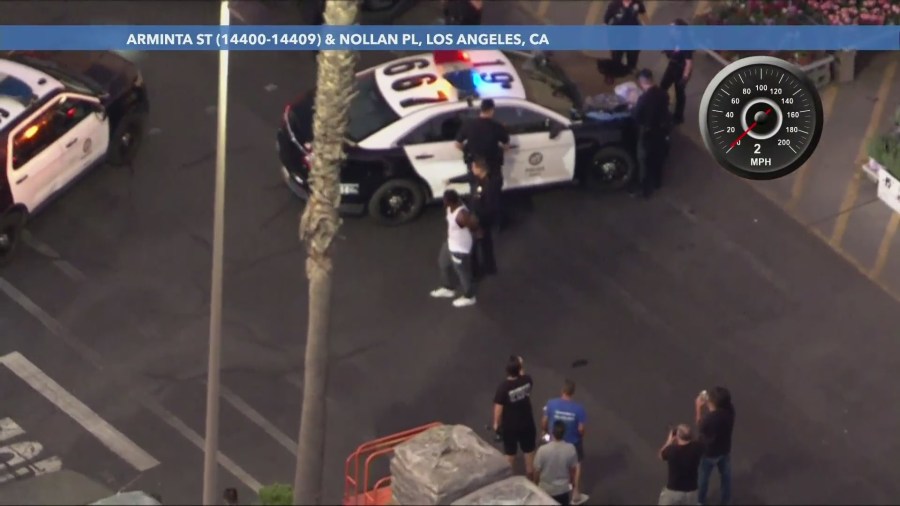 The suspect was taken into custody after police found him inside the Home Depot store. He had taken off a yellow sweater in an attempt to blend in. (KTLA)