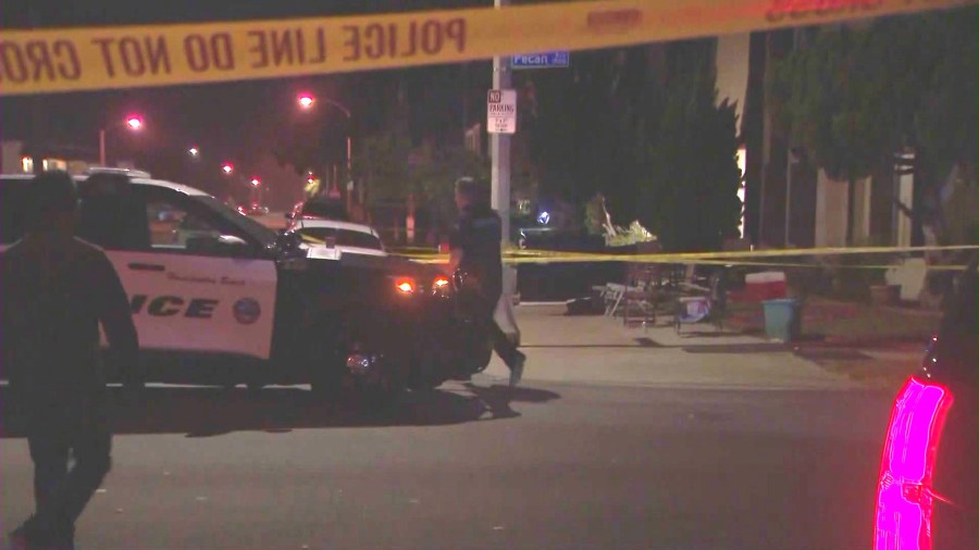 Police investigate outside a Huntington Beach apartment complex where a mass stabbing left two people dead and three others hospitalized on July 4, 2024. (OC Hawk)