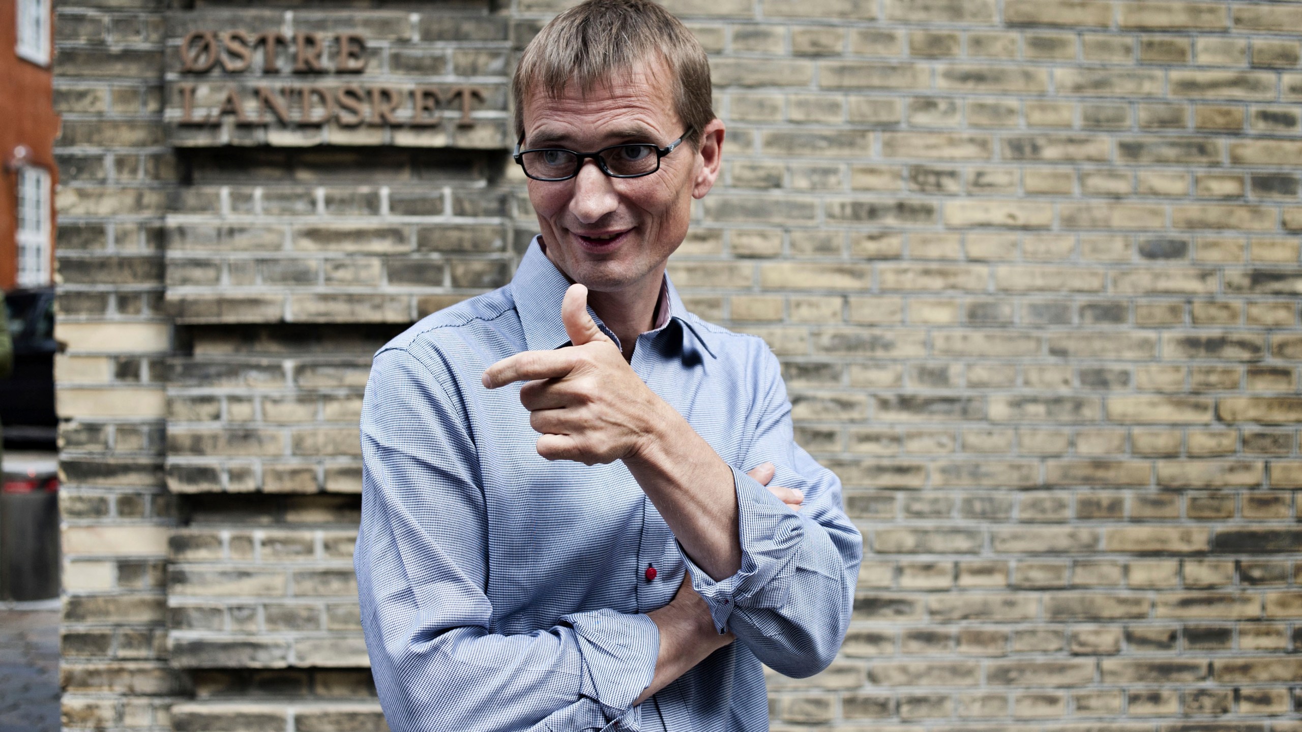 FILE -Niels Holck smiles outside Easter High Court in Copenhagen, Denmark, June 30, 2011. (AP Photo/Ilan Brander/POLFOTO, File)