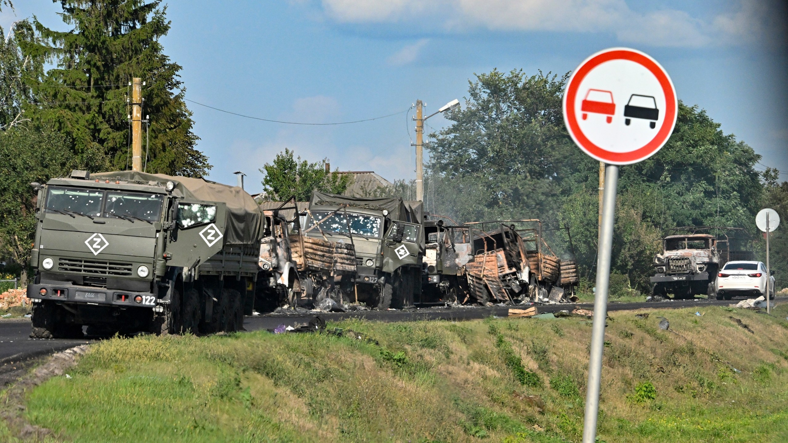 FILE - A column of Russian army trucks damaged by shelling by Ukrainian forces is seen on the highway in the Sudzhansky district in the Kursk region of Russia, on Aug. 9, 2024. (Anatoliy Zhdanov/Kommersant Publishing House via AP, File)