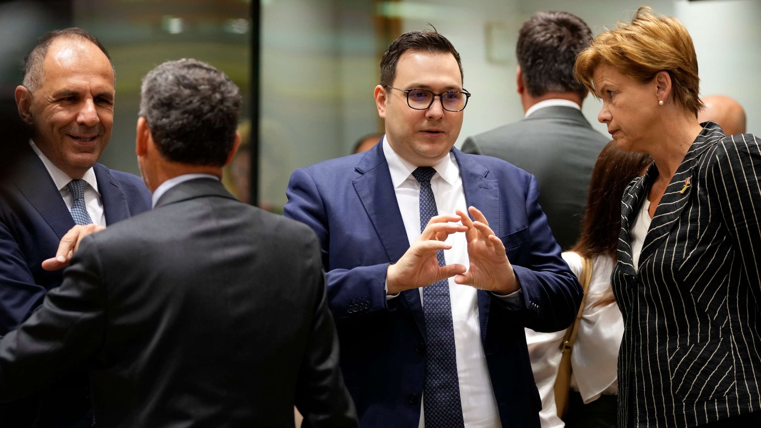 Czech Republic's Foreign Minister Jan Lipavsky, second right, speaks with Latvia's Foreign Minister Baiba Braze during a meeting of EU foreign ministers at the European Council building in Brussels, Thursday, Aug. 29, 2024. (AP Photo/Virginia Mayo)