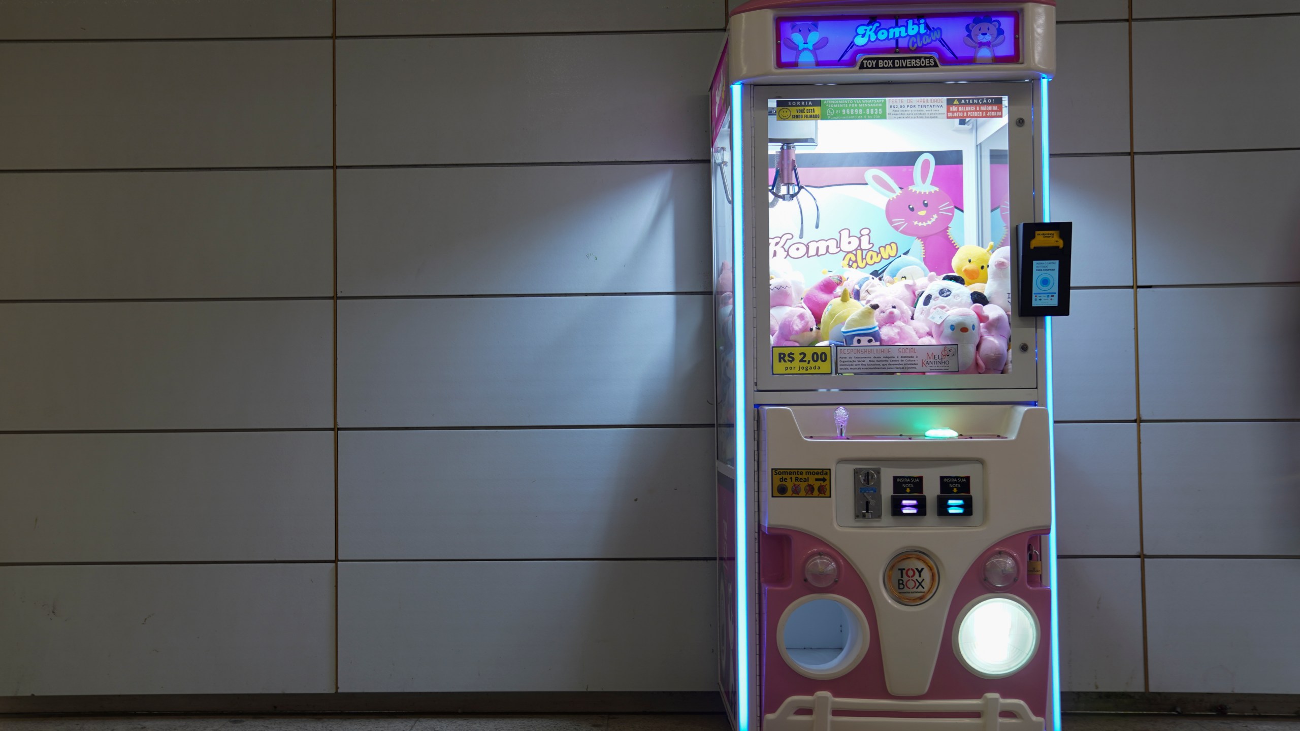 A claw machine sits inside a metro station in Rio de Janeiro, Wednesday, Aug. 28, 2024. The Rio police press office said they were carrying out search warrants targeting claw machines because they are considered games of chance and therefore illegal. (AP Photo/Hannah-Kathryn Valles)