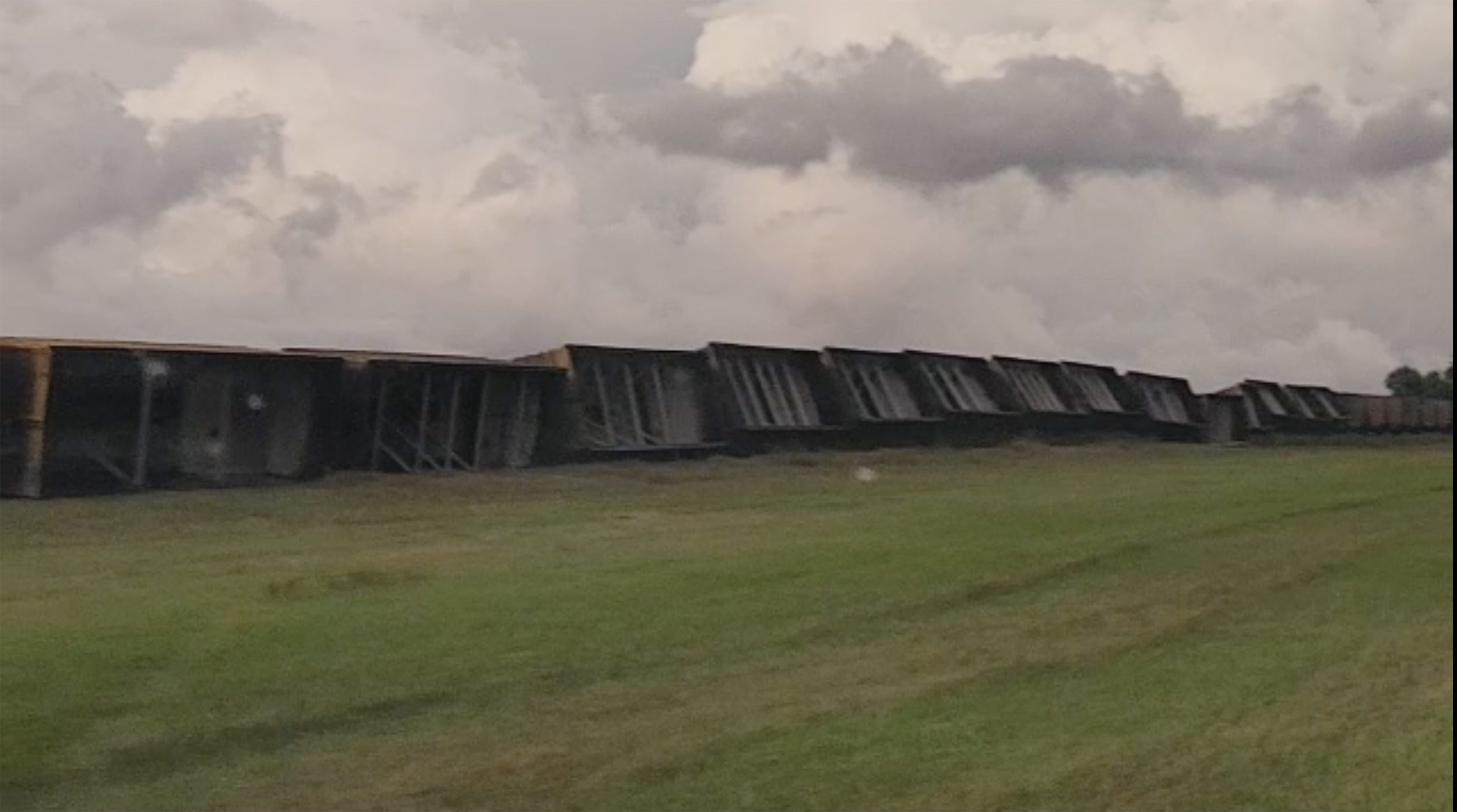 Railroad cars are knocked off the tracks due to high winds Wednesday night, near Steele, N.D., on Thursday, Aug. 29, 2024. (Rebecca Neustel via AP)