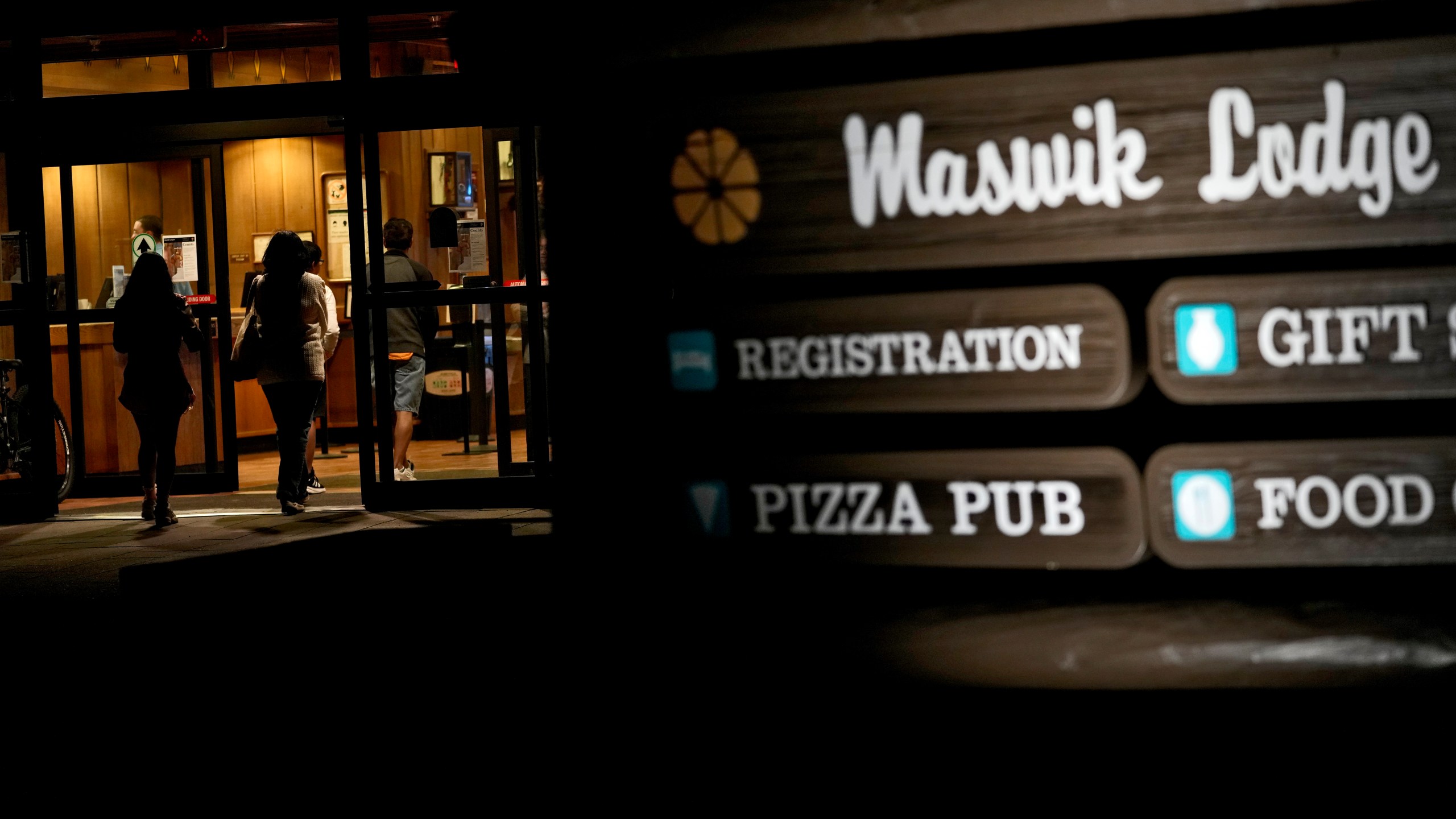 Guests leave the Maswik Lodge, Wednesday, Aug. 28, 2024, in Grand Canyon, Arizona. Visitors won't be able to stay overnight in hotels at Grand Canyon National Park beginning Thursday after a series of breaks in the only pipeline that serves the popular tourist destination. The restrictions will run throughout the Labor Day holiday, when hotels are near or at capacity. (AP Photo/Matt York)