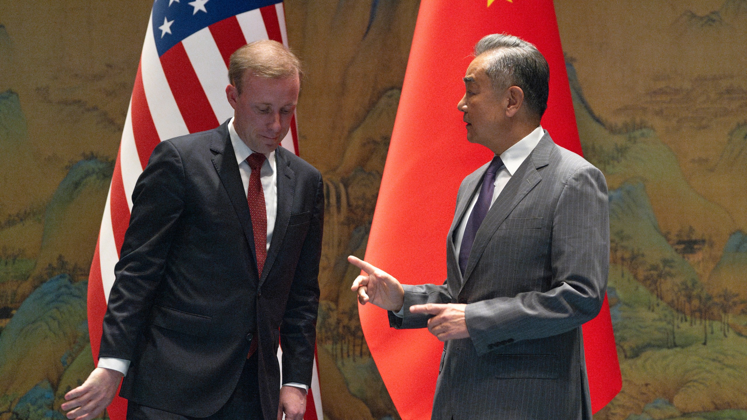 Wang Yi, right, the director of the Communist Party's Central Foreign Affairs Commission Office gestures to White House national security adviser Jake Sullivan, before their talk at Yanqi lake in Beijing, Tuesday, Aug. 27, 2024. (AP Photo/Ng Han Guan, Pool)