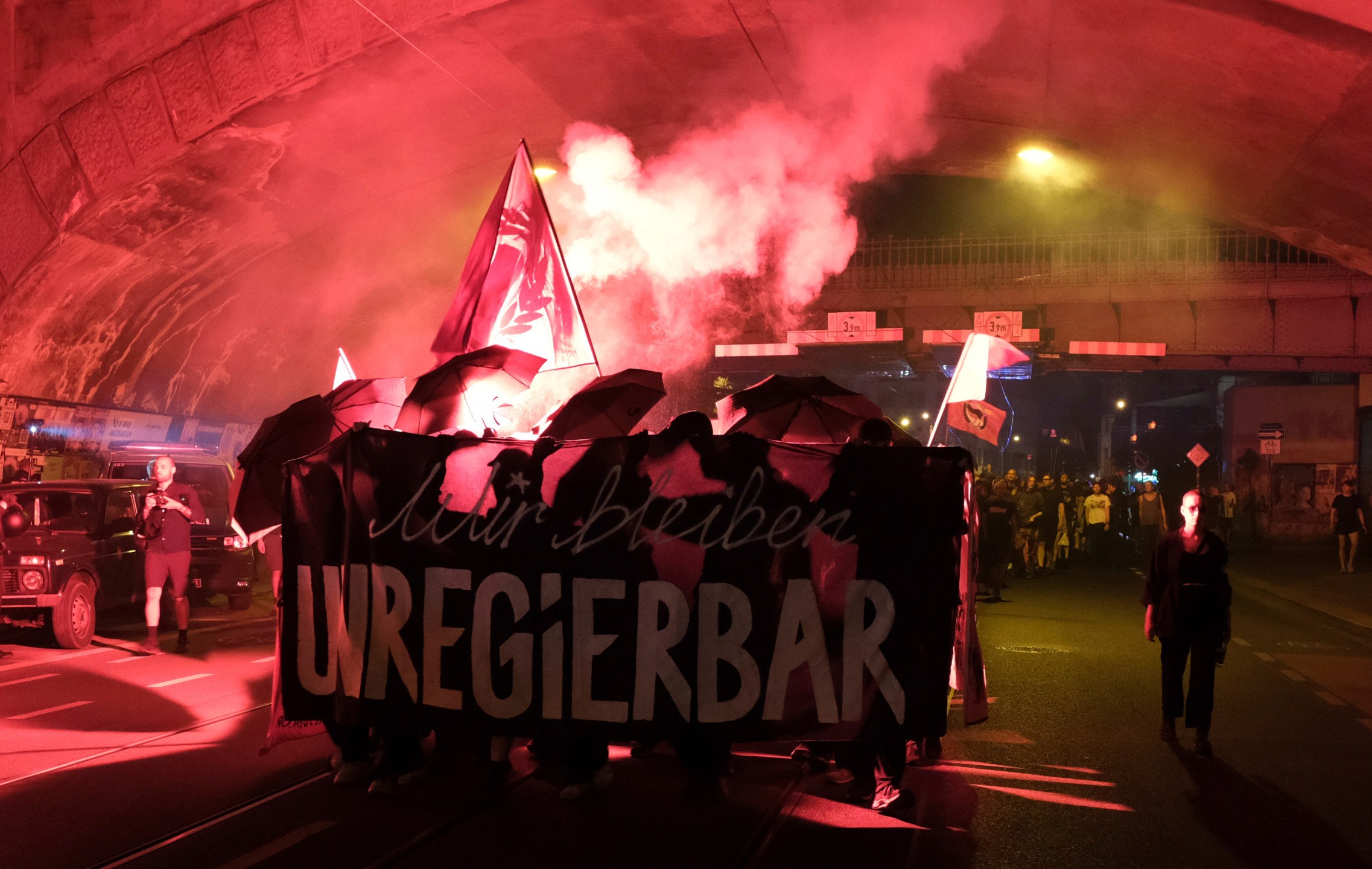 Protesters light pyrotechnics during a rally against the growth of right-wing parties in the state elections for Saxony, in Dresden, Germany, Sunday, Sept. 1, 2024. (Sebastian Willnow/dpa via AP)