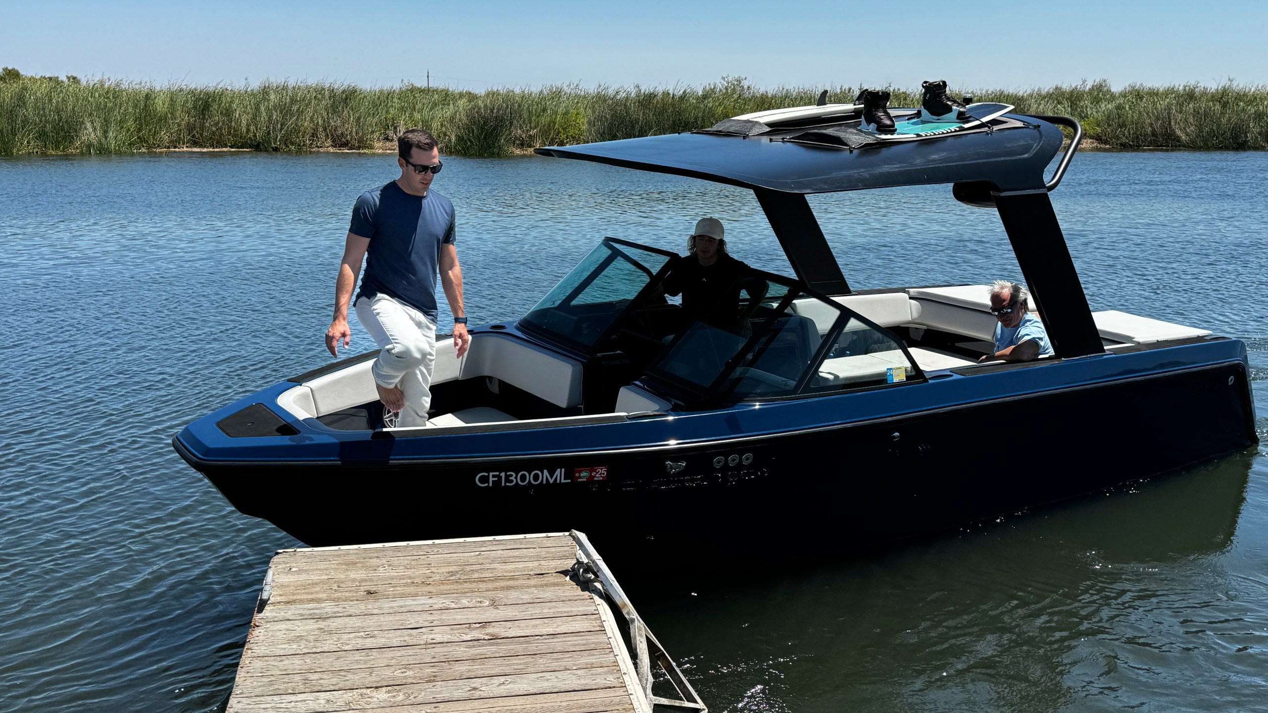 Mitch Lee, co-founder and CEO of Arc Boats, steps off an Arc Sport, an electric boat made by his California company, in the Sacramento-San Joaquin Delta near Bethel Island, Calif. on July 31, 2024. (AP Photo/Terry Chea)