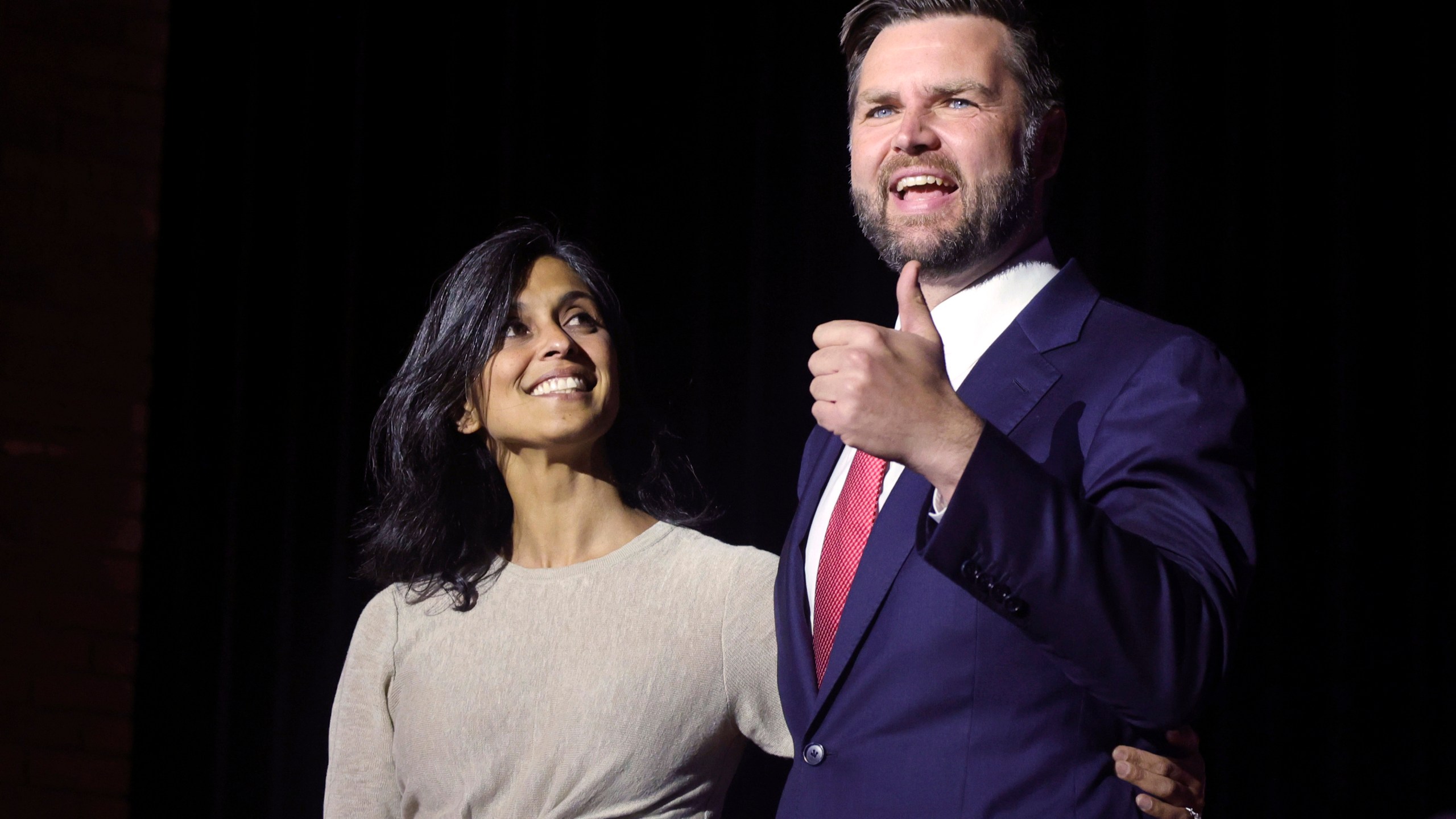 FILE - Republican vice presidential candidate Sen. JD Vance, R-Ohio, right, takes the stage with his wife Usha Vance during a rally in his home town of Middletown, Ohio, July 22, 2024. (AP Photo/Paul Vernon, File)