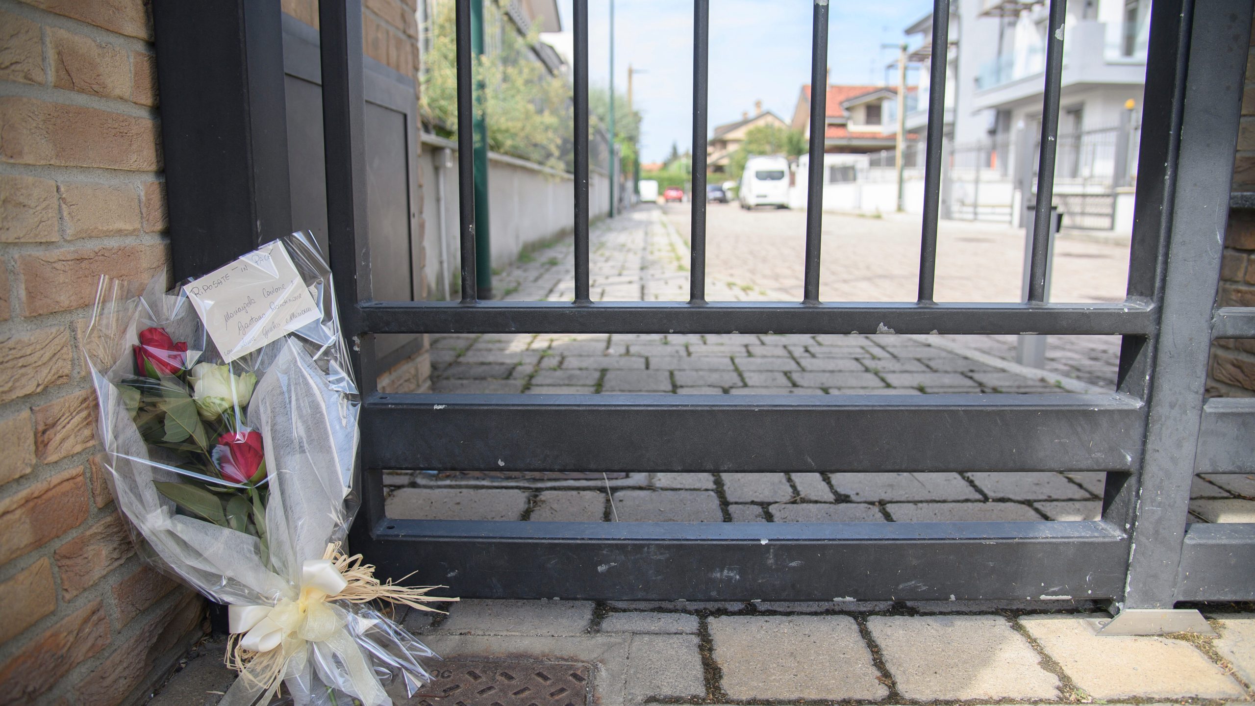 Flowers are left, Monday, Sep. 2, 2024, outside the house where a 17-year-old boy killed his brother and parents in Paderno Dugnano near Milan, northern Italy, Sunday, Sept. 1, 2024. Italian prosecutors on Monday said a 17-year-old high school student who confessed to stabbing to death his 12-year-old brother and parents had been suffering a general sense of “malaise,” but has been unable to provide a motive for a triple homicide that has shocked Italians. (Photo Claudio Furlan/Lapresse via AP)