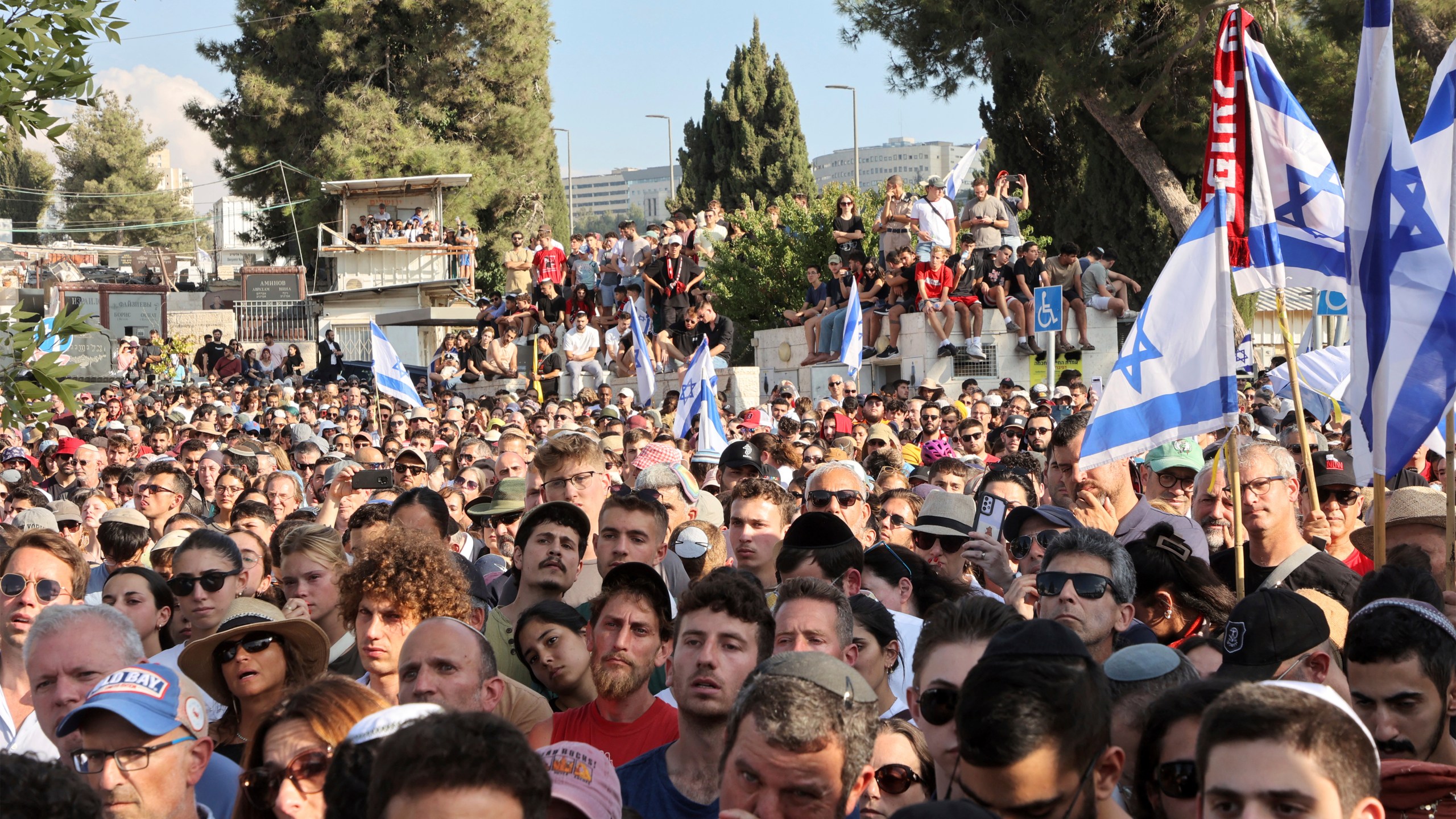 Mourners attend the funeral of Israeli-American hostage Hersh Goldberg-Polin, who was killed in Hamas captivity in the Gaza Strip, in Jerusalem, Monday, Sept. 2, 2024. (Gil Cohen-Magen/Pool via AP)