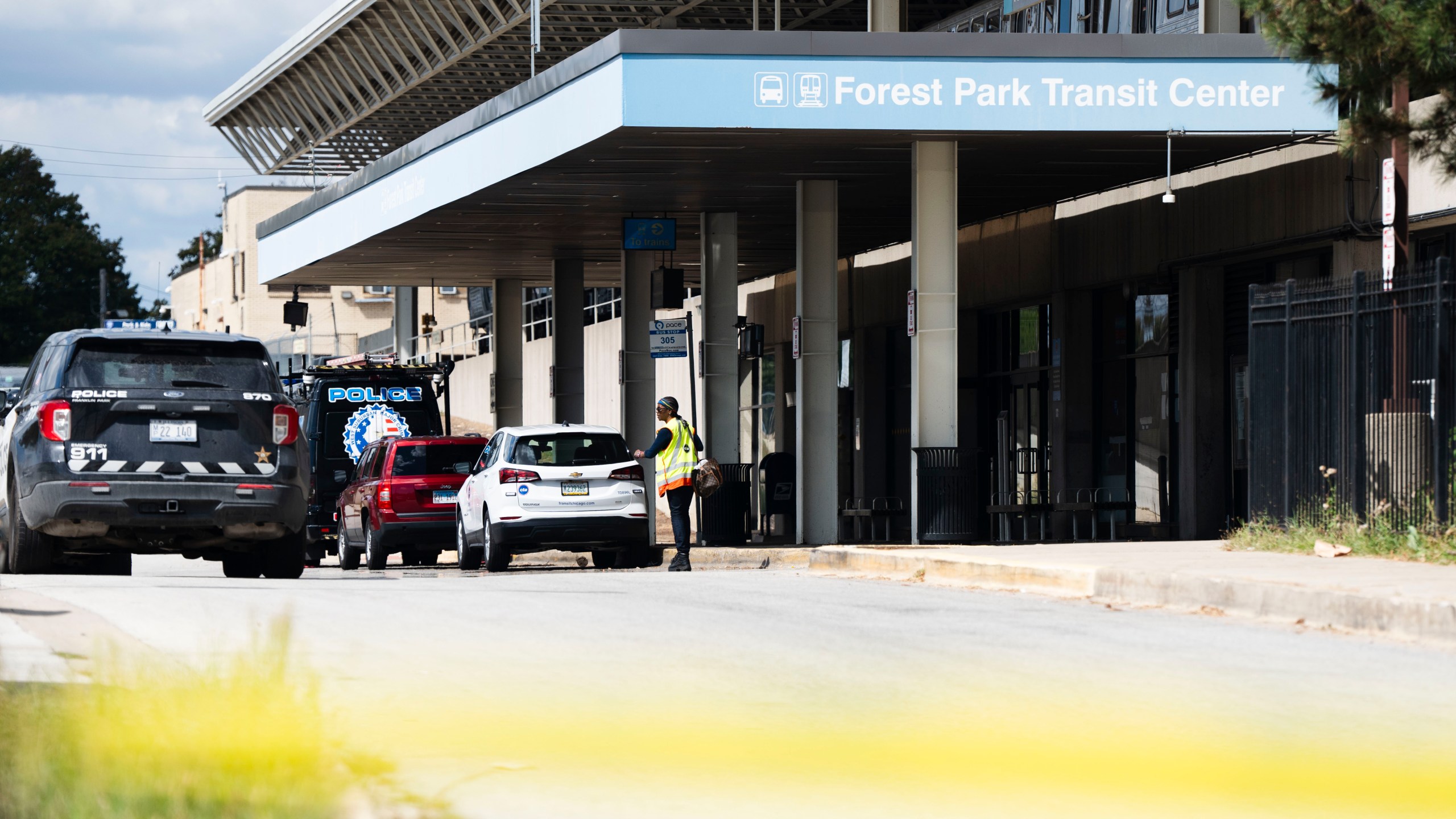 Yellow tape blocks off the parking lot of the Forest Park Blue Line train station in Forest Park, Ill., after four people were fatally shot on the train early Monday, Sept. 2, 2024. (Pat Nabong/Chicago Sun-Times via AP)