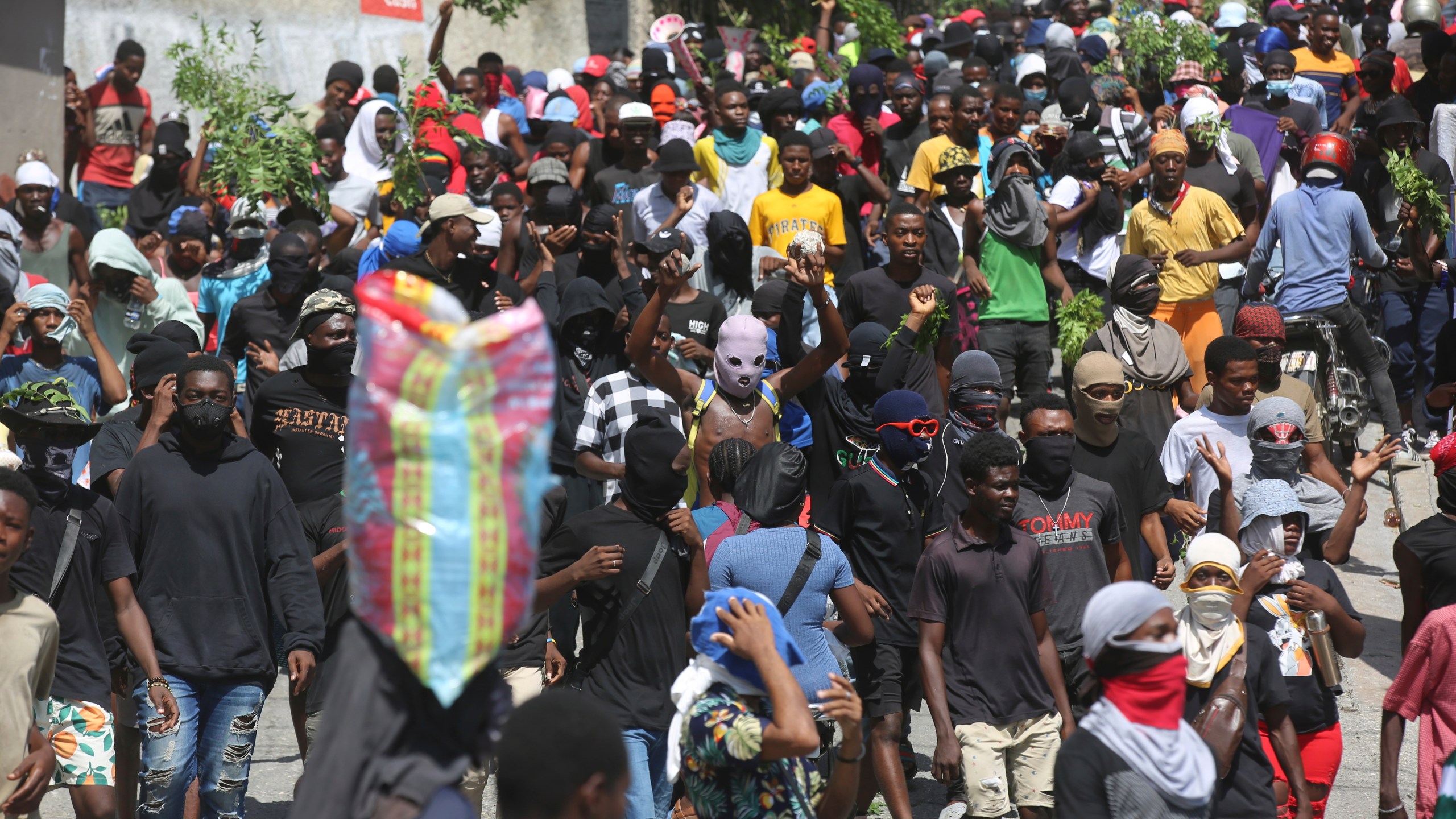 People protest for the police and Prime Minister to take immediate action against gangs in Port-au-Prince, Haiti, Monday, Aug. 19, 2024. (AP Photo/Odelyn Joseph)