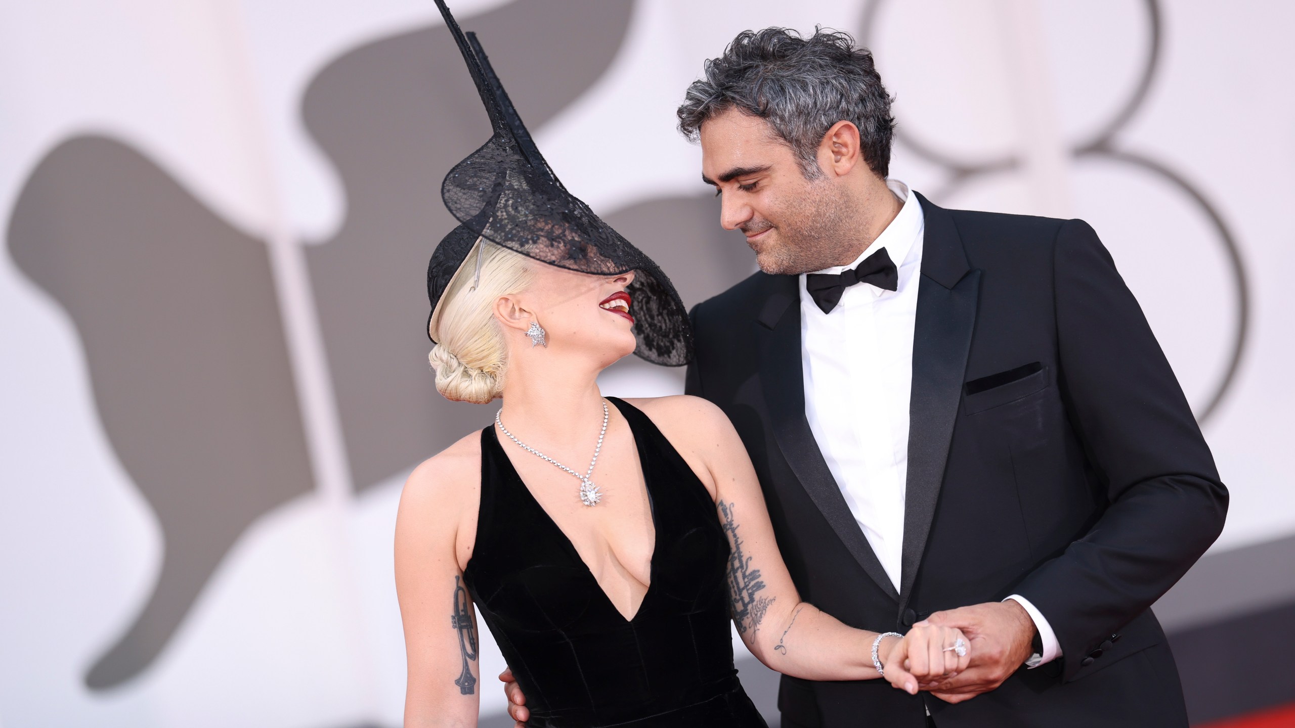 Lady Gaga, left, and Michael Polansky pose for photographers upon arrival for the premiere of the film 'Joker: Folie A Deux' during the 81st edition of the Venice Film Festival in Venice, Italy, on Wednesday, Sept. 4, 2024. (Photo by Vianney Le Caer/Invision/AP)