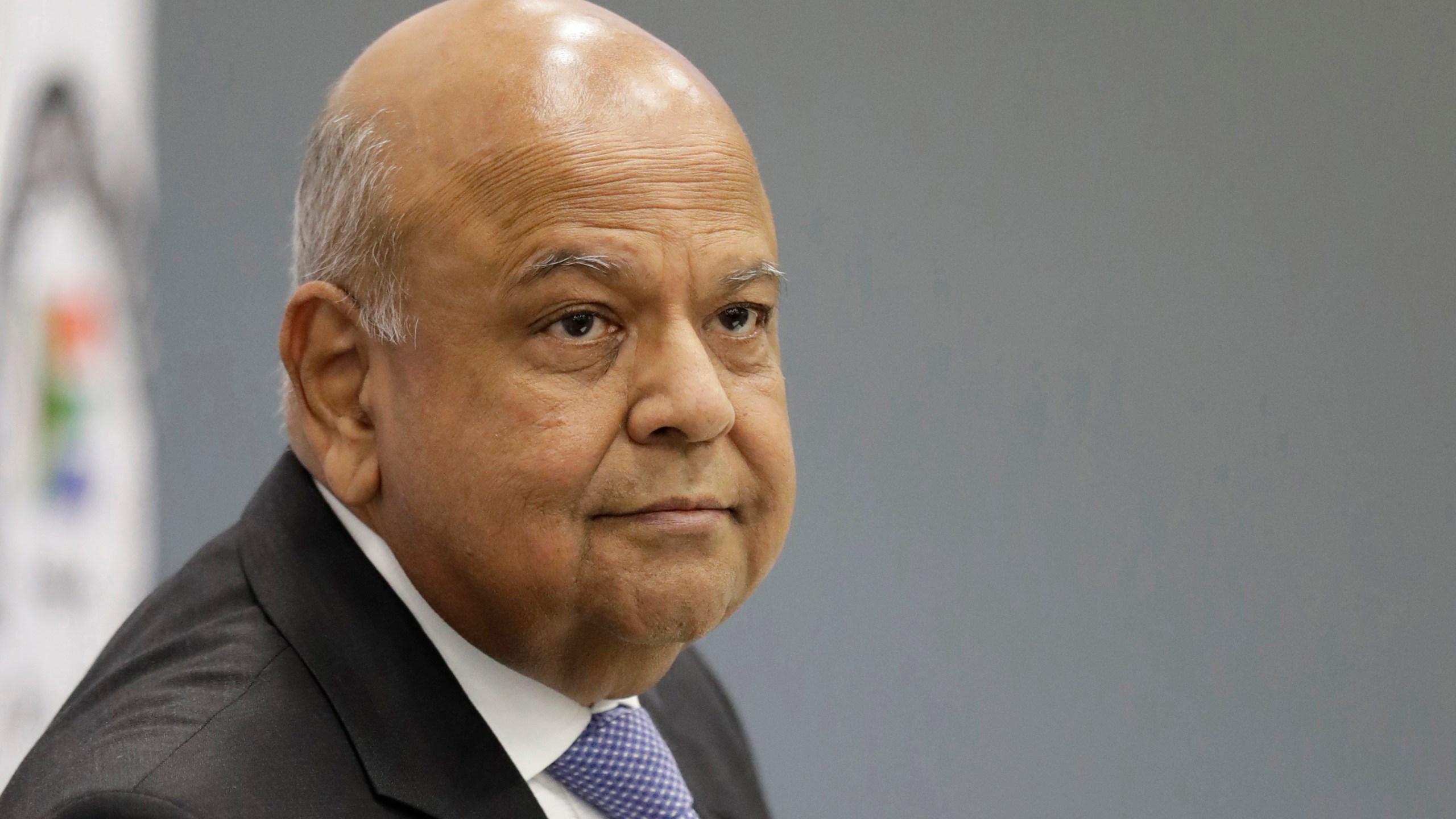 FILE - South Africa's Public Enterprises Minister Pravin Gordhan appears at the judicial commission of inquiry into state capture in Johannesburg, South Africa, Nov. 19, 2018. (AP Photo/Themba Hadebe, File)