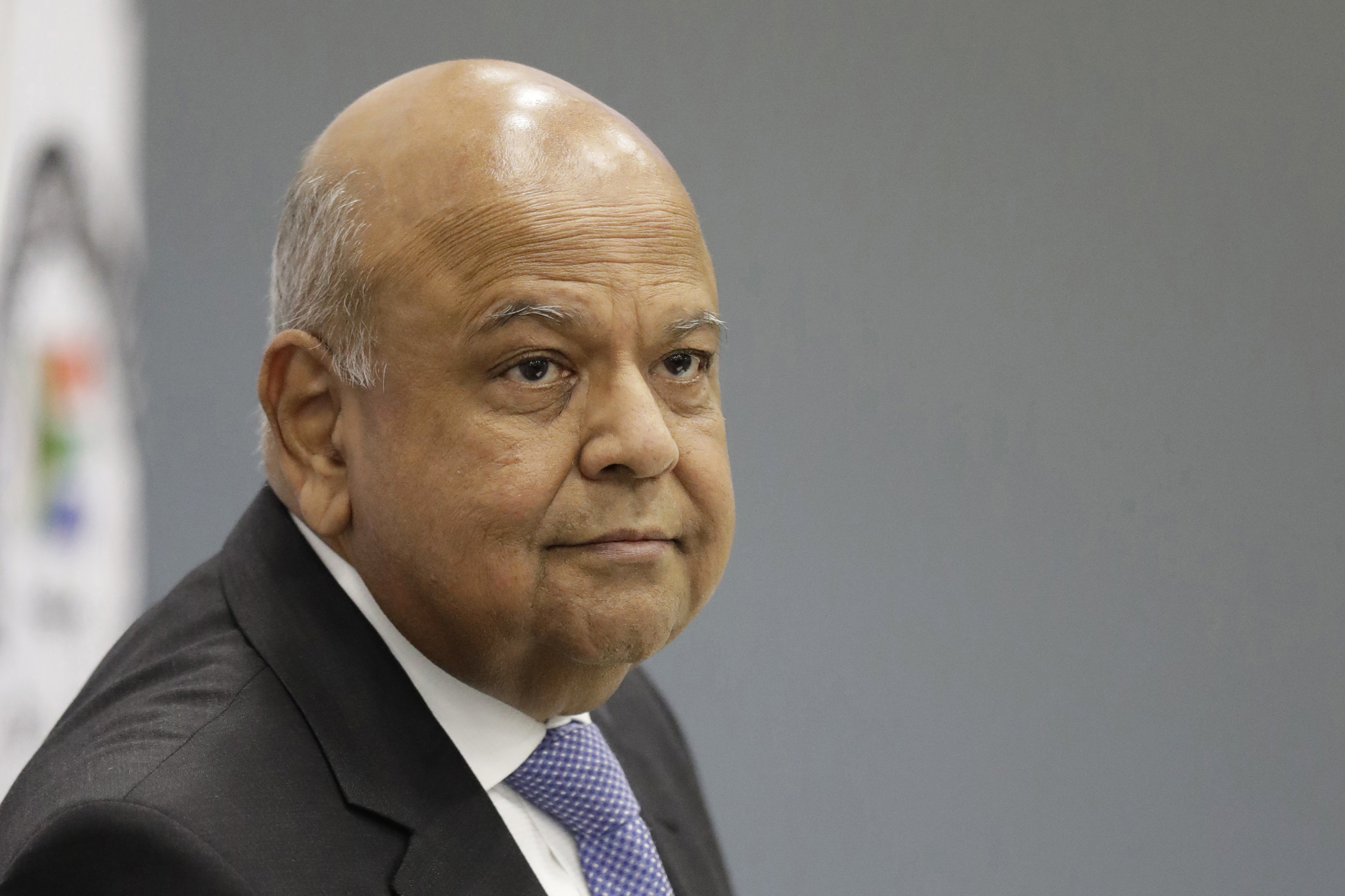 FILE - South Africa's Public Enterprises Minister Pravin Gordhan appears at the judicial commission of inquiry into state capture in Johannesburg, South Africa, Nov. 19, 2018. (AP Photo/Themba Hadebe, File)