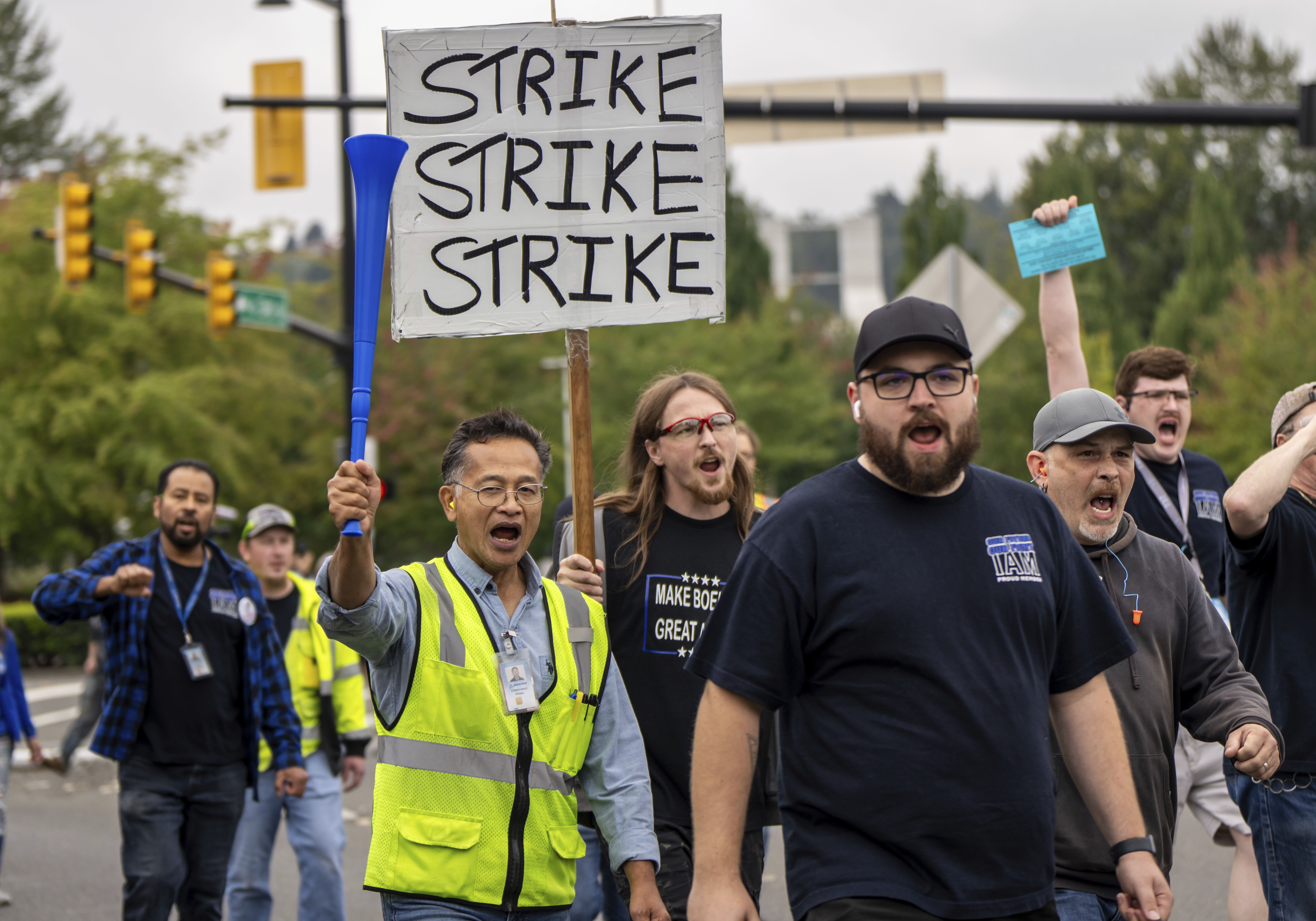 International Aerospace Machinists union members march toward the union's hall to vote on a contract offer with airplane maker Boeing, on Thursday, Sept. 12, 2024, in Renton, Wash. (AP Photo/Stephen Brashear)