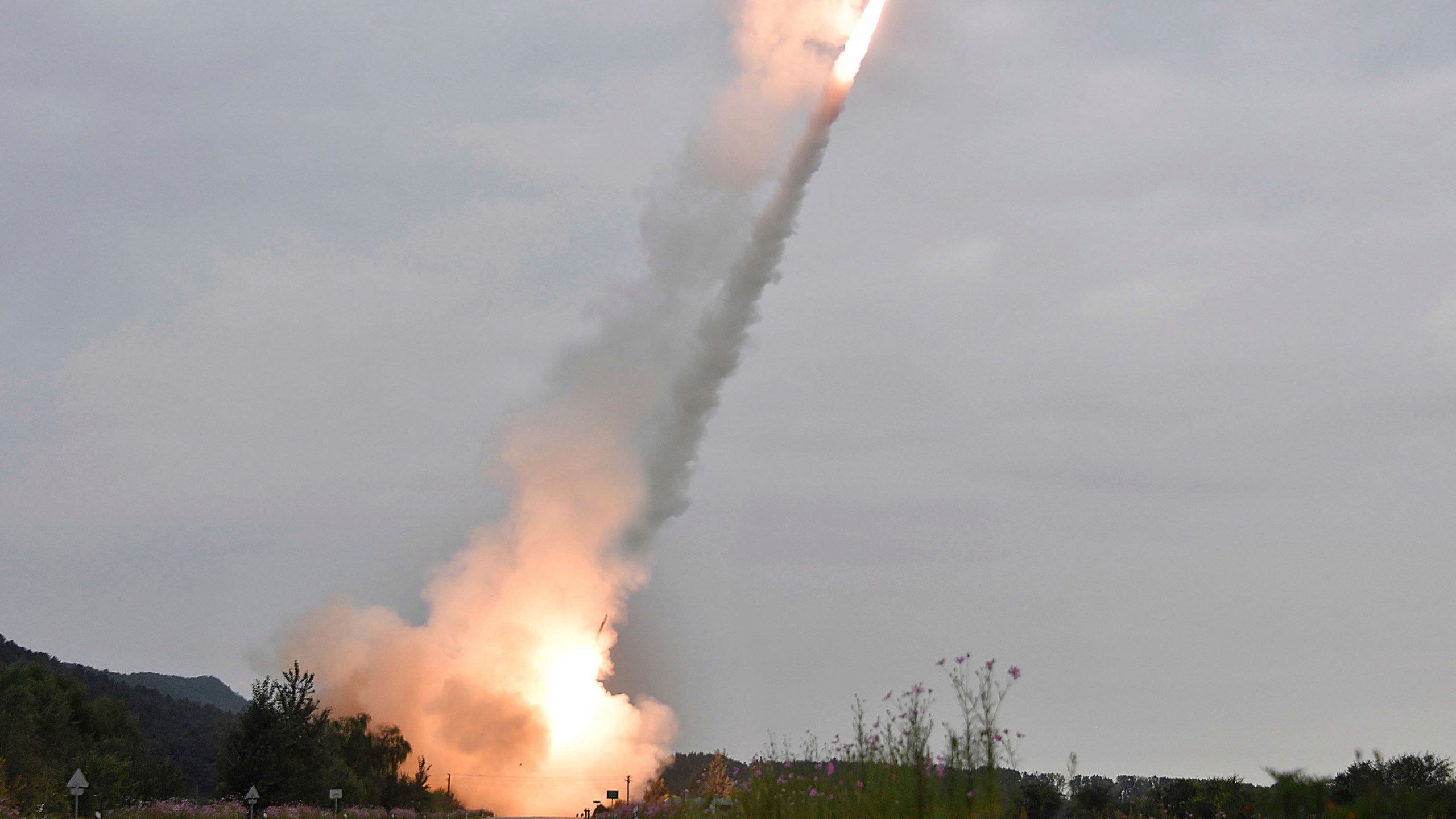 This undated photo provided on Friday, Sept. 13, 2024, by the North Korean government shows what they say is test-firing from their new launch vehicle of 600mm multiple rockets at an undisclosed location in North Korea. Independent journalists were not given access to cover the event depicted in this image distributed by the North Korean government. The content of this image is as provided and cannot be independently verified. Korean language watermark on image as provided by source reads: "KCNA" which is the abbreviation for Korean Central News Agency. (Korean Central News Agency/Korea News Service via AP)