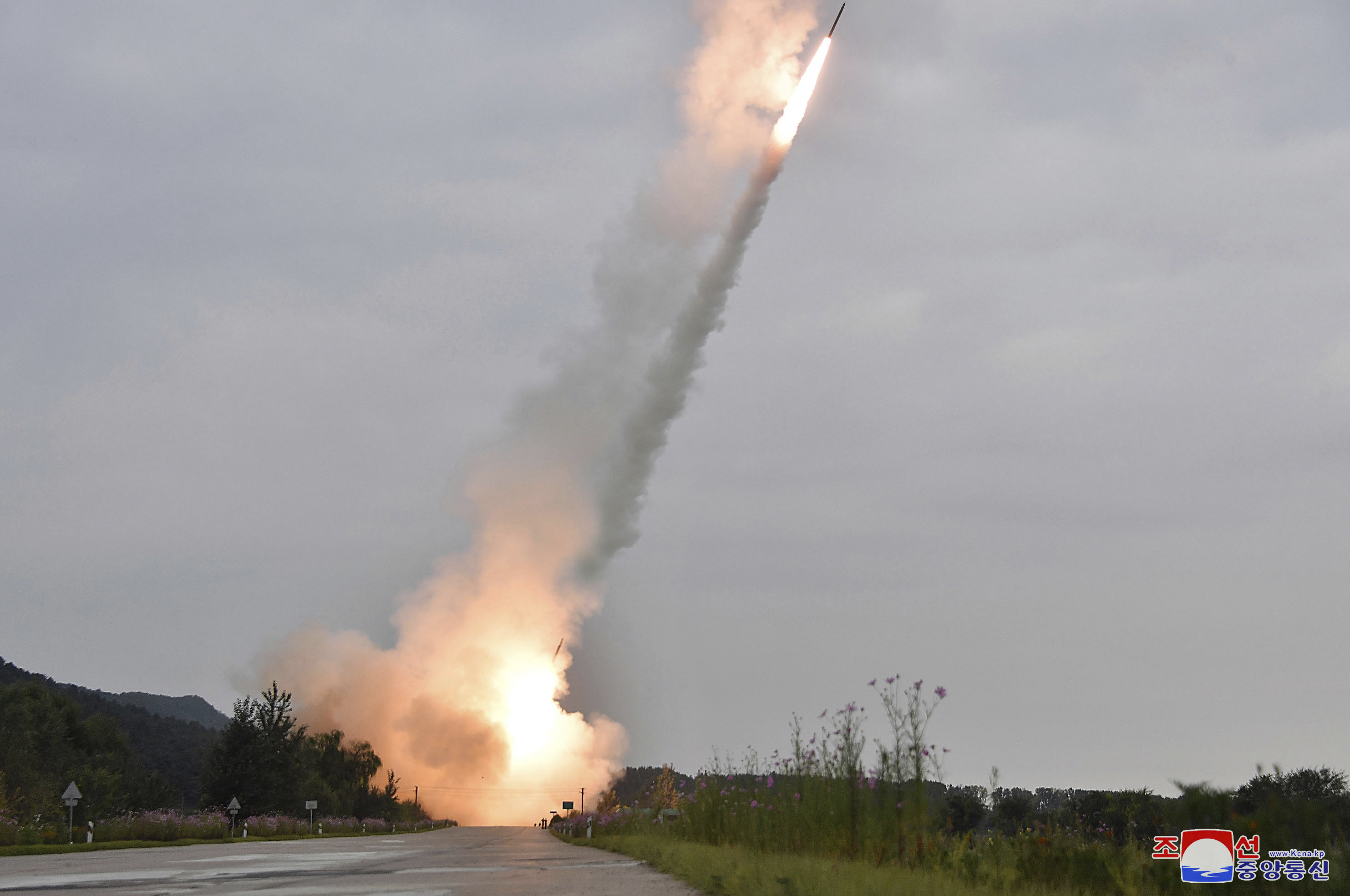 This undated photo provided on Friday, Sept. 13, 2024, by the North Korean government shows what they say is test-firing from their new launch vehicle of 600mm multiple rockets at an undisclosed location in North Korea. Independent journalists were not given access to cover the event depicted in this image distributed by the North Korean government. The content of this image is as provided and cannot be independently verified. Korean language watermark on image as provided by source reads: "KCNA" which is the abbreviation for Korean Central News Agency. (Korean Central News Agency/Korea News Service via AP)