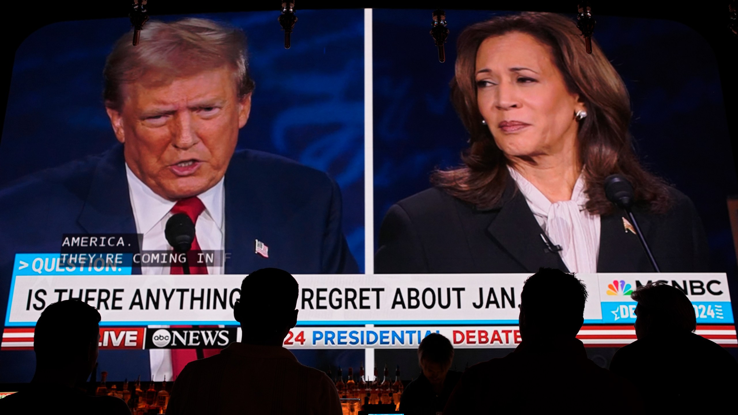 People watch the presidential debate between Republican presidential nominee former President Donald Trump and Democratic presidential nominee Vice President Kamala Harris, Tuesday, Sept. 10, 2024, at the Gipsy Las Vegas in Las Vegas. (AP Photo/John Locher)