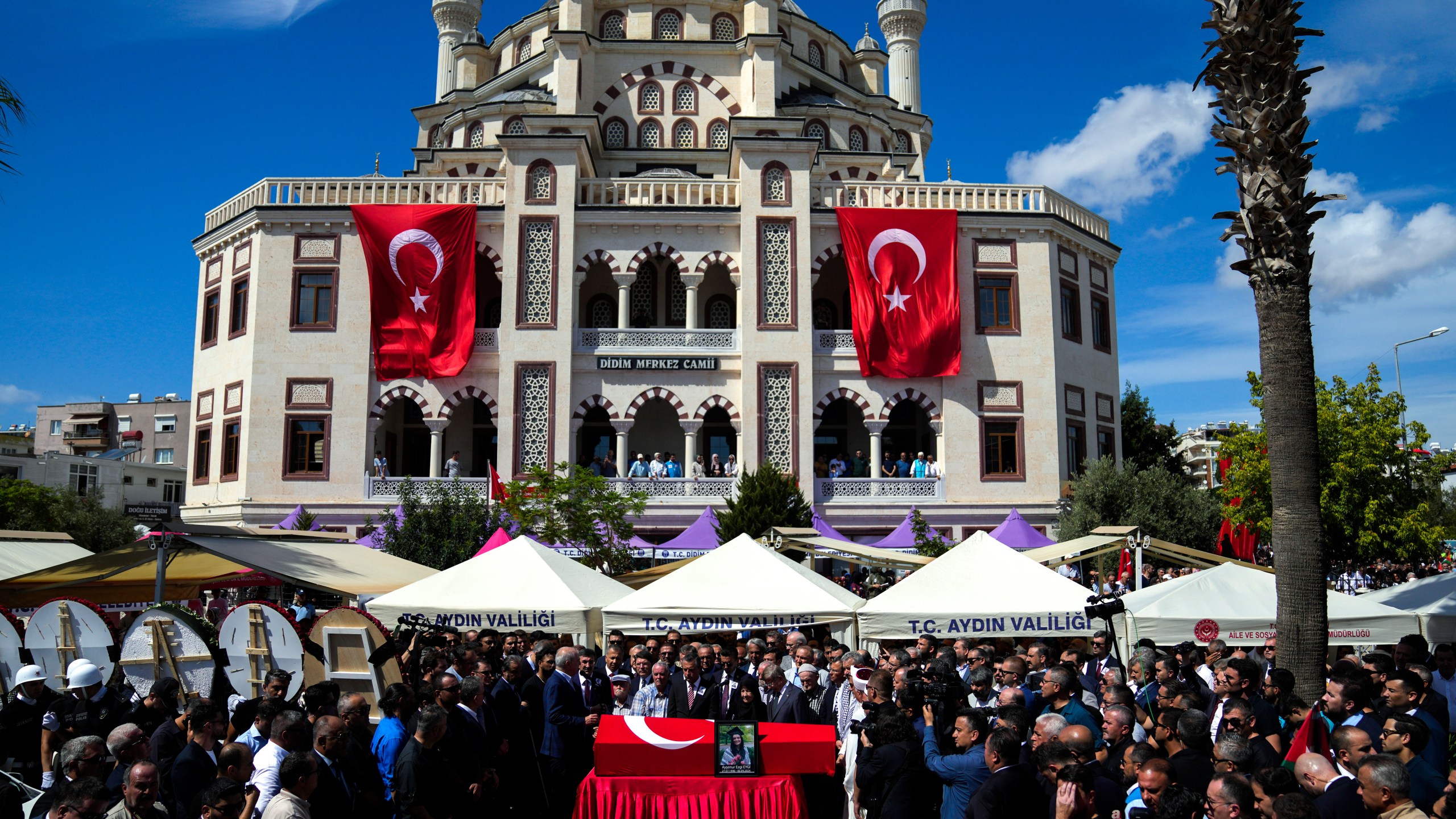 People attend the funeral prayers for Aysenur Ezgi Eygi, 26 year-old Turkish-American activist killed by the Israeli military, outside the central mosque of City of Didim, Turkey, Saturday, Sept. 14, 2024. (AP Photo/Khalil Hamra)