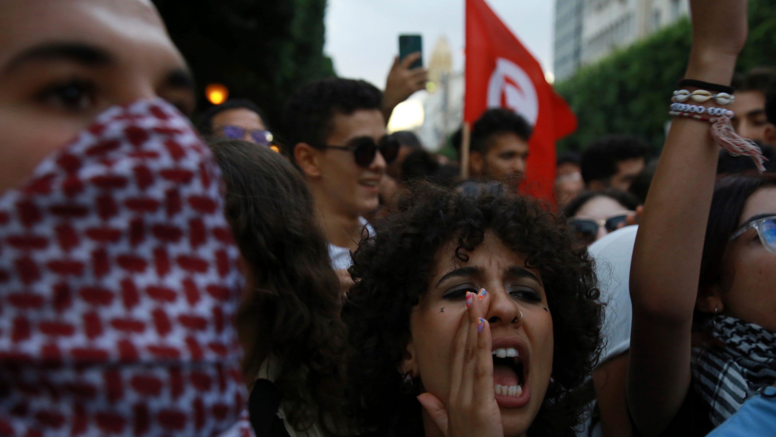 Tunisian take part in a protest against President Kais Saied ahead of the upcoming presidential elections, Friday, Sept. 13, 2024, on Avenue Habib Bourguiba in the capital Tunis. (AP Photo/Anis Mili)