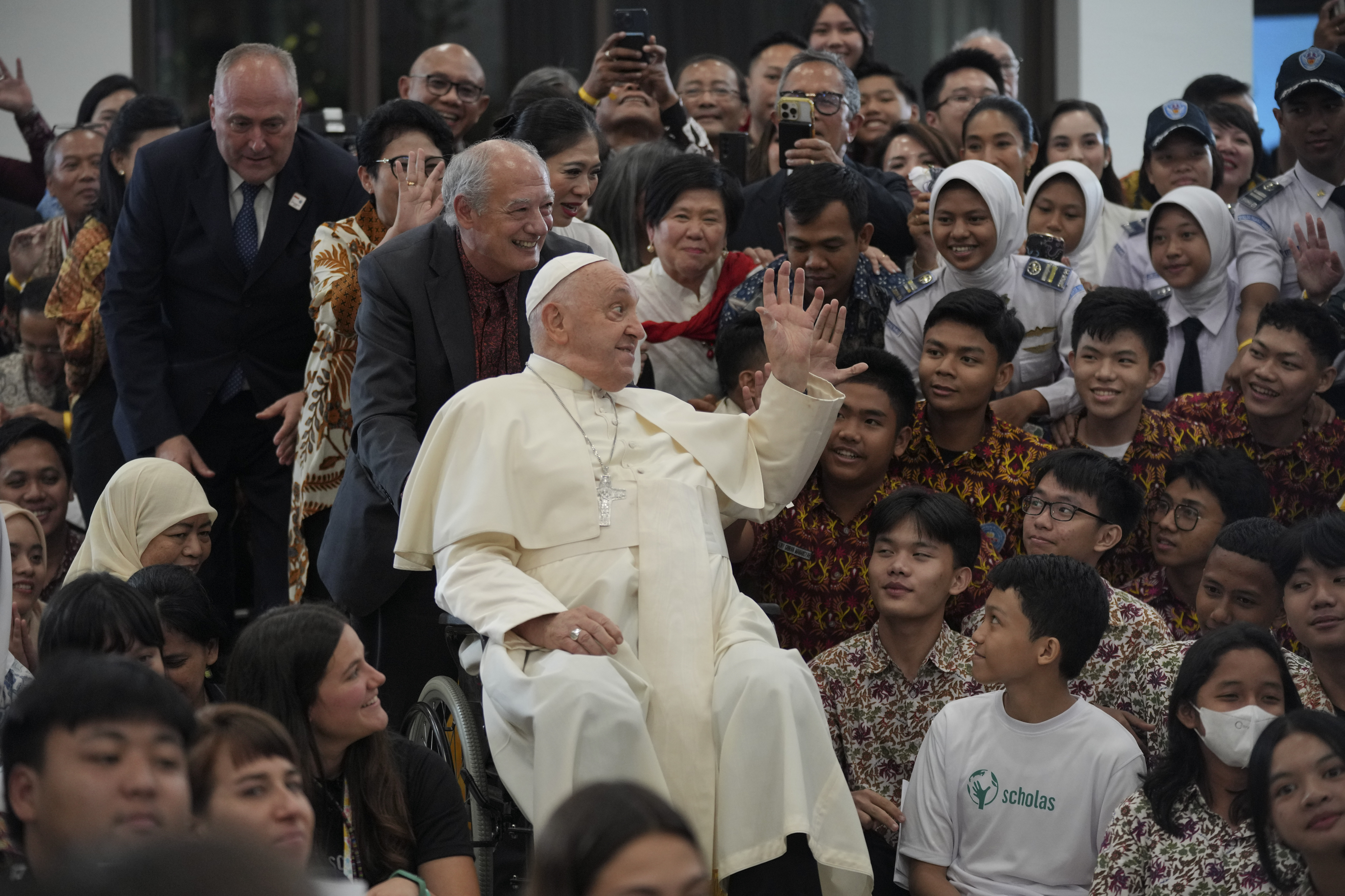 Pope Francis interacts with the young people of Scholas Occurrentes at Grha Pemuda Youth Center in Jakarta, Indonesia, Wednesday, Sept. 4, 2024. (AP Photo/Tatan Syuflana, Pool)