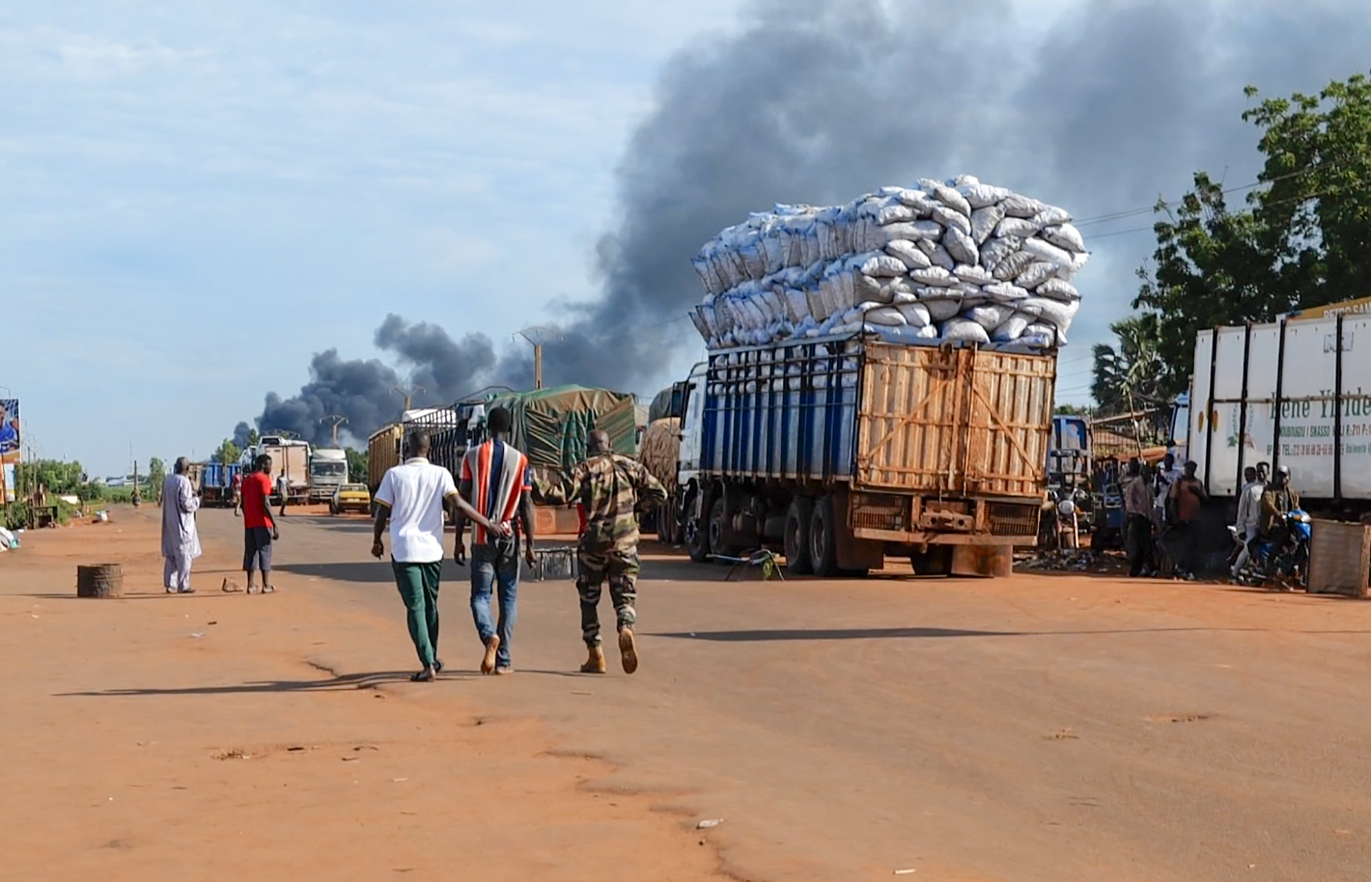 This video grab shows Malian security personnel detaining a man after Mali's army said a military training camp in the capital Bamako has been attacked early Tuesday, Sept. 17 2024. (AP Photo)