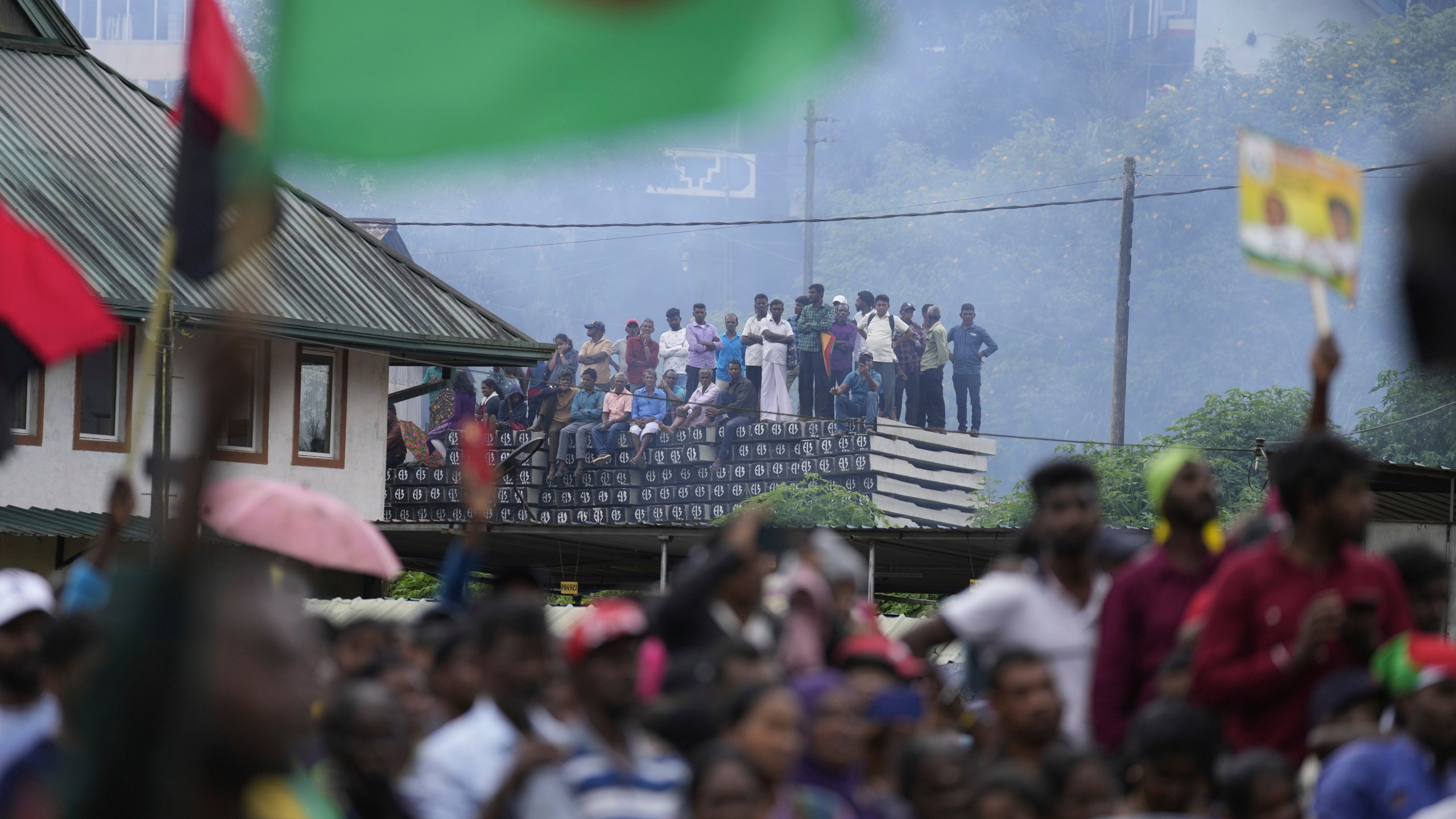 Tea plantation workers attend a presidential election rally in Thalawakele, Sri Lanka, Sunday, Sept. 8, 2024. (AP Photo/Eranga Jayawardena)