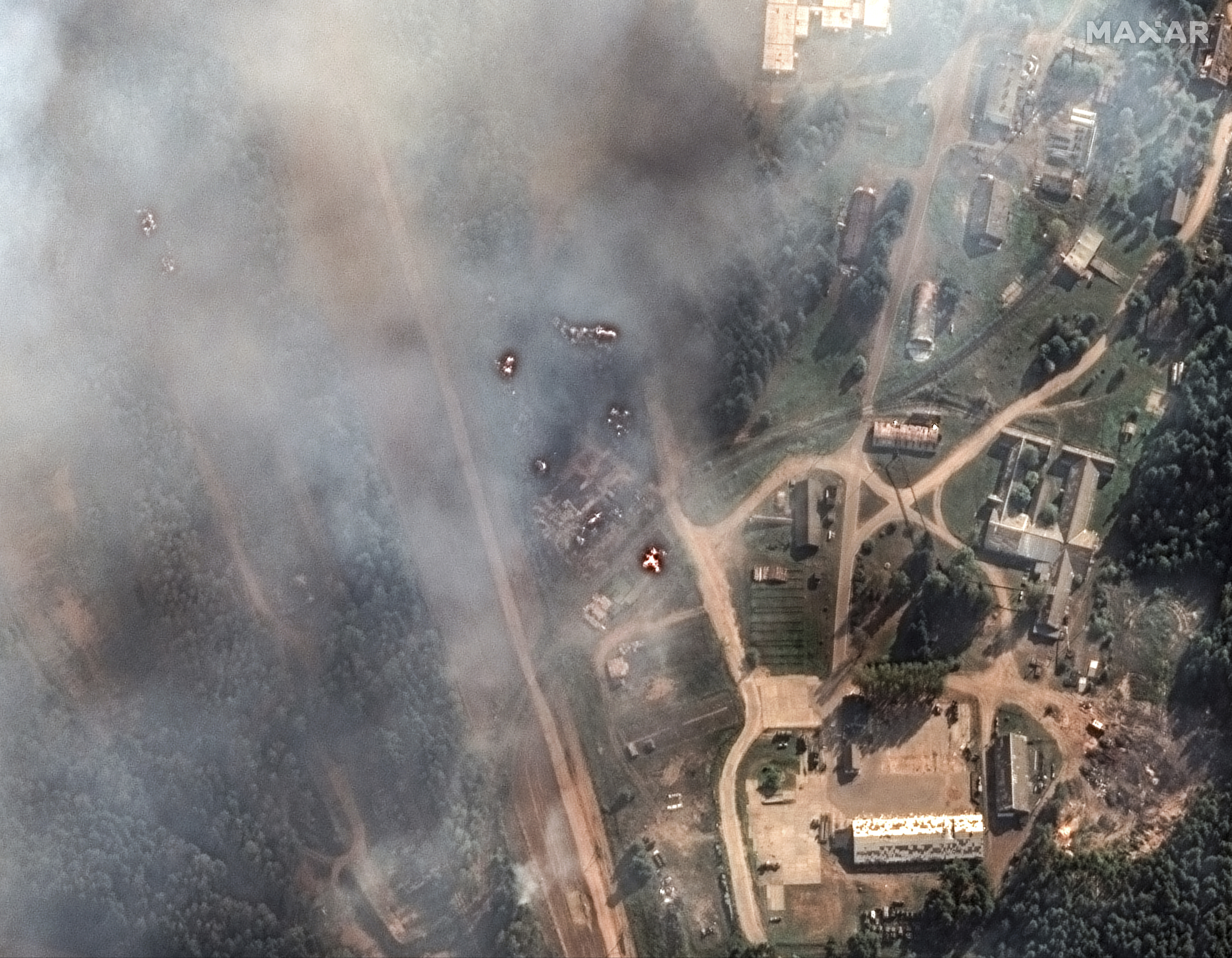 General view of the aftermath of a large series of explosion on an ammunition depot in Toropets, Russia, Wednesday Sept. 18, 2024. (Satellite image ©2023 Maxar Technologies via AP)