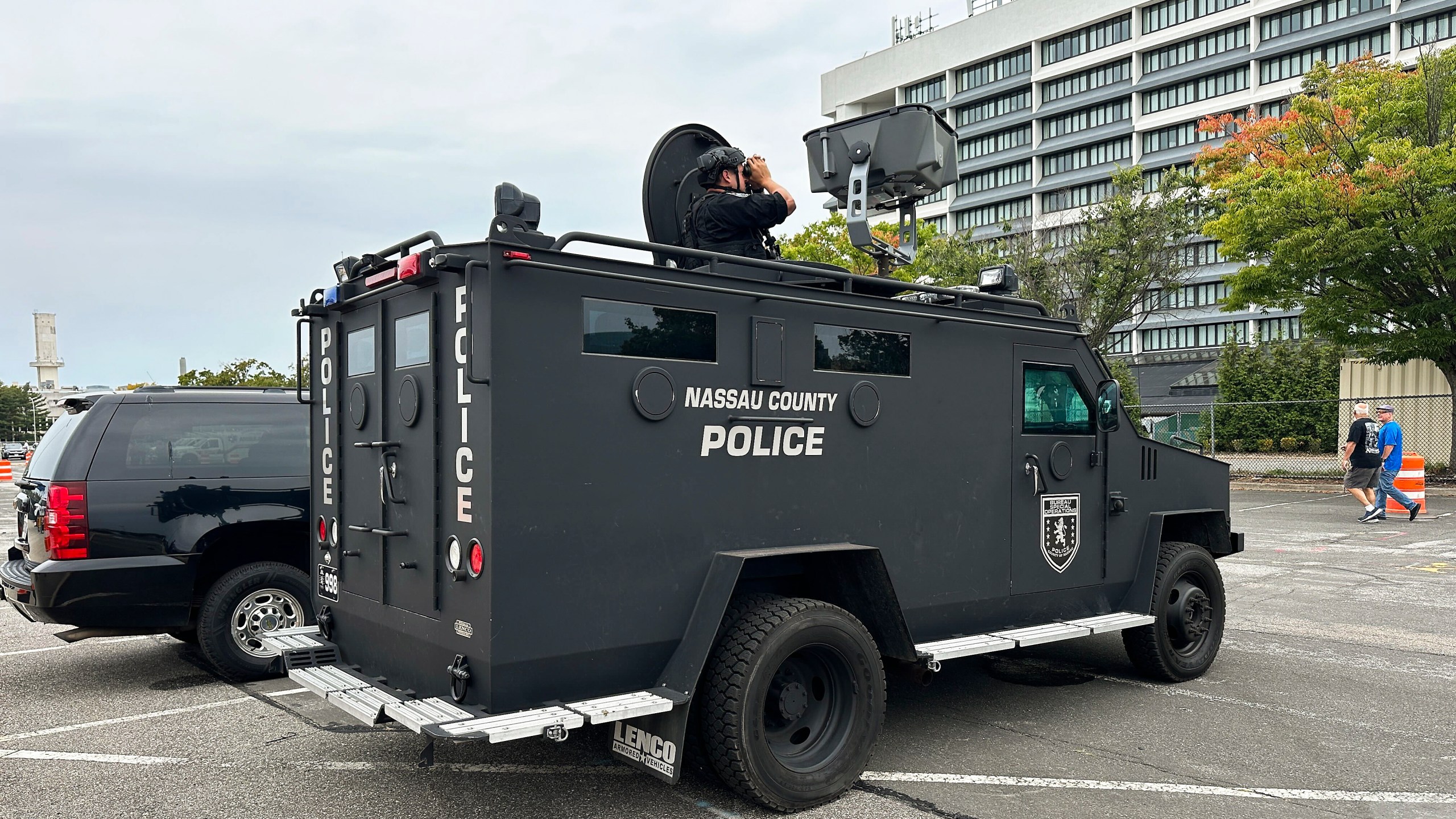 Nassau County Police scan buildings surrounding Nassau Coliseum before the start of a rally featuring Republican presidential nominee former President Donald Trump, Wednesday, Sept. 18, 2024, in Uniondale, N.Y. (AP Photo/Ted Shaffrey)