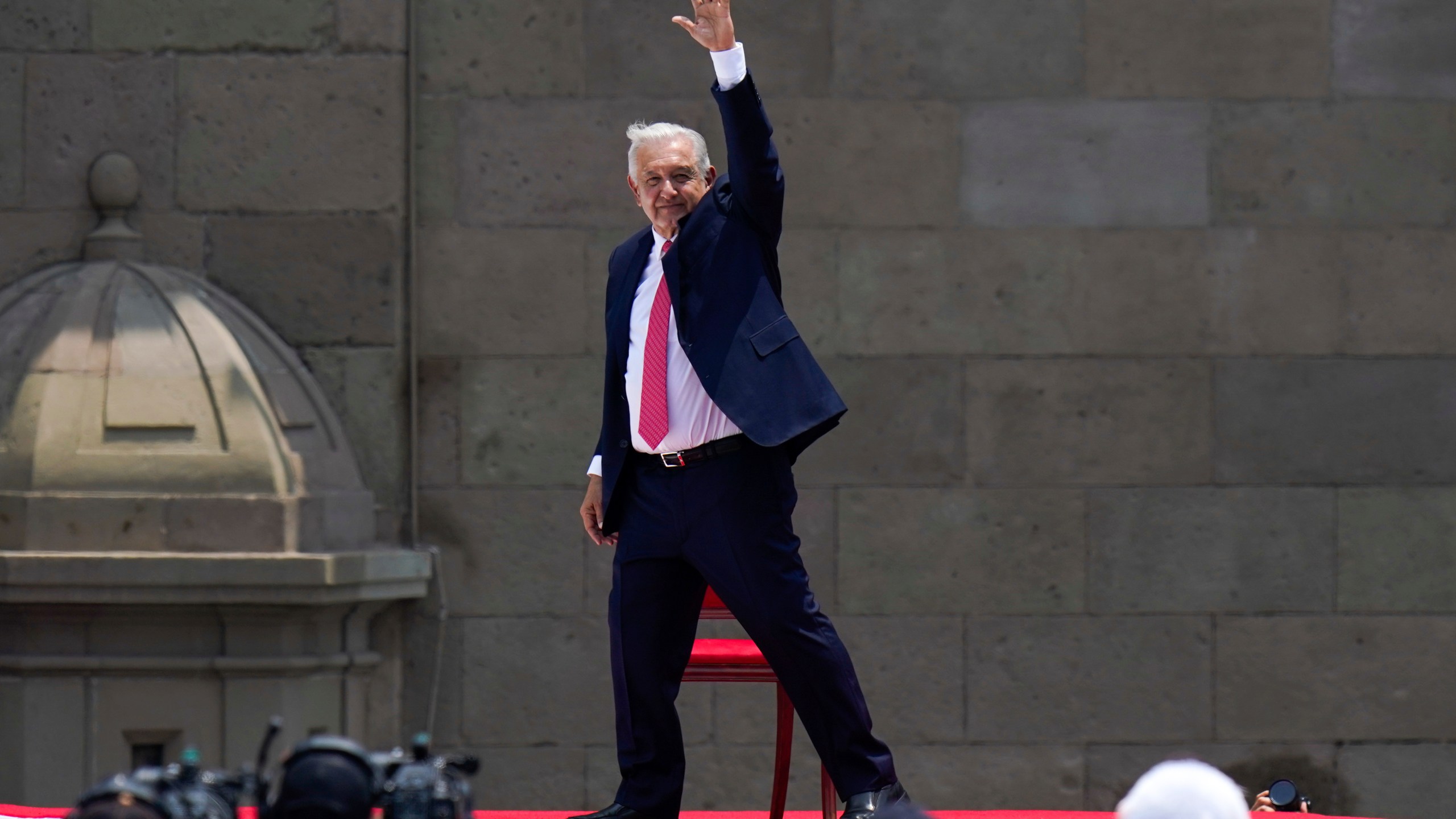 Outgoing President Andres Manuel Lopez Obrador waves after delivering his last State of the Union at the Zocalo, Mexico City's main square, Sunday, Sept. 1, 2024. (AP Photo/Felix Marquez)